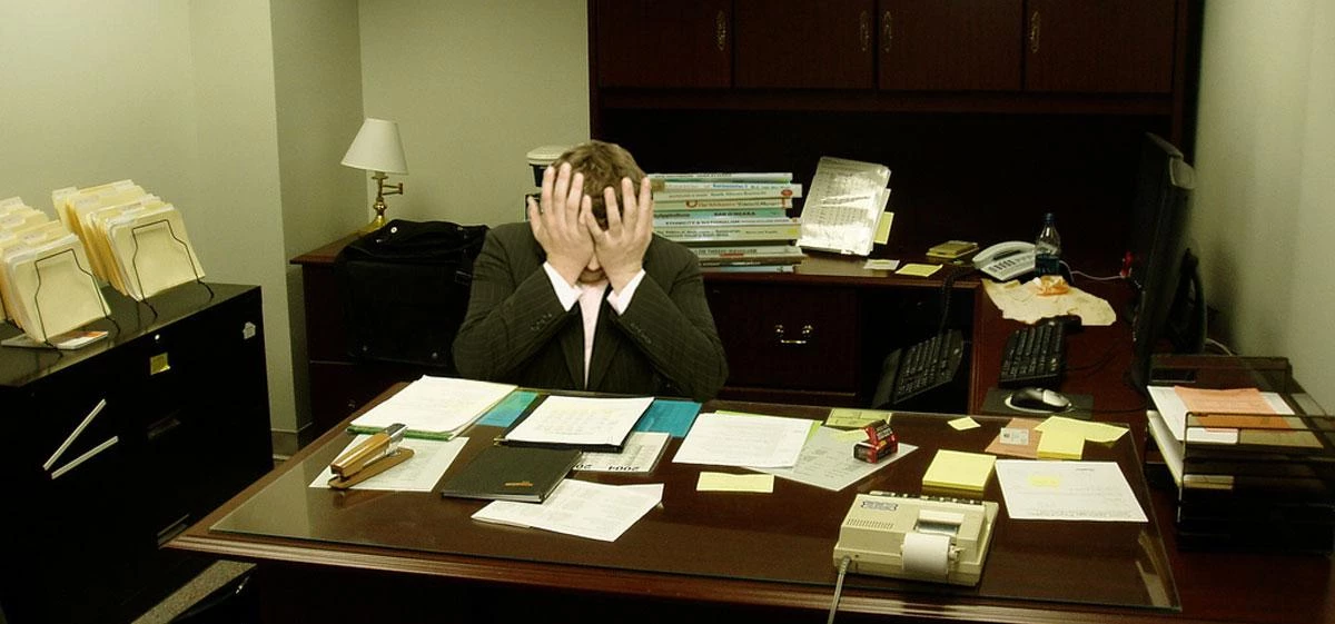 "Frustrated man at a desk" by LaurMG. - Own work.. Licensed under CC BY-SA 3.0 via Wikimedia Commons