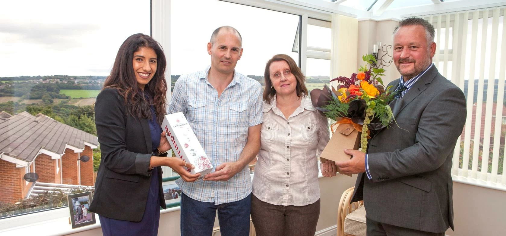 Tony and Beverley Cuthbert in their new orangery with Pennine Managing Director Graham Auld and Head