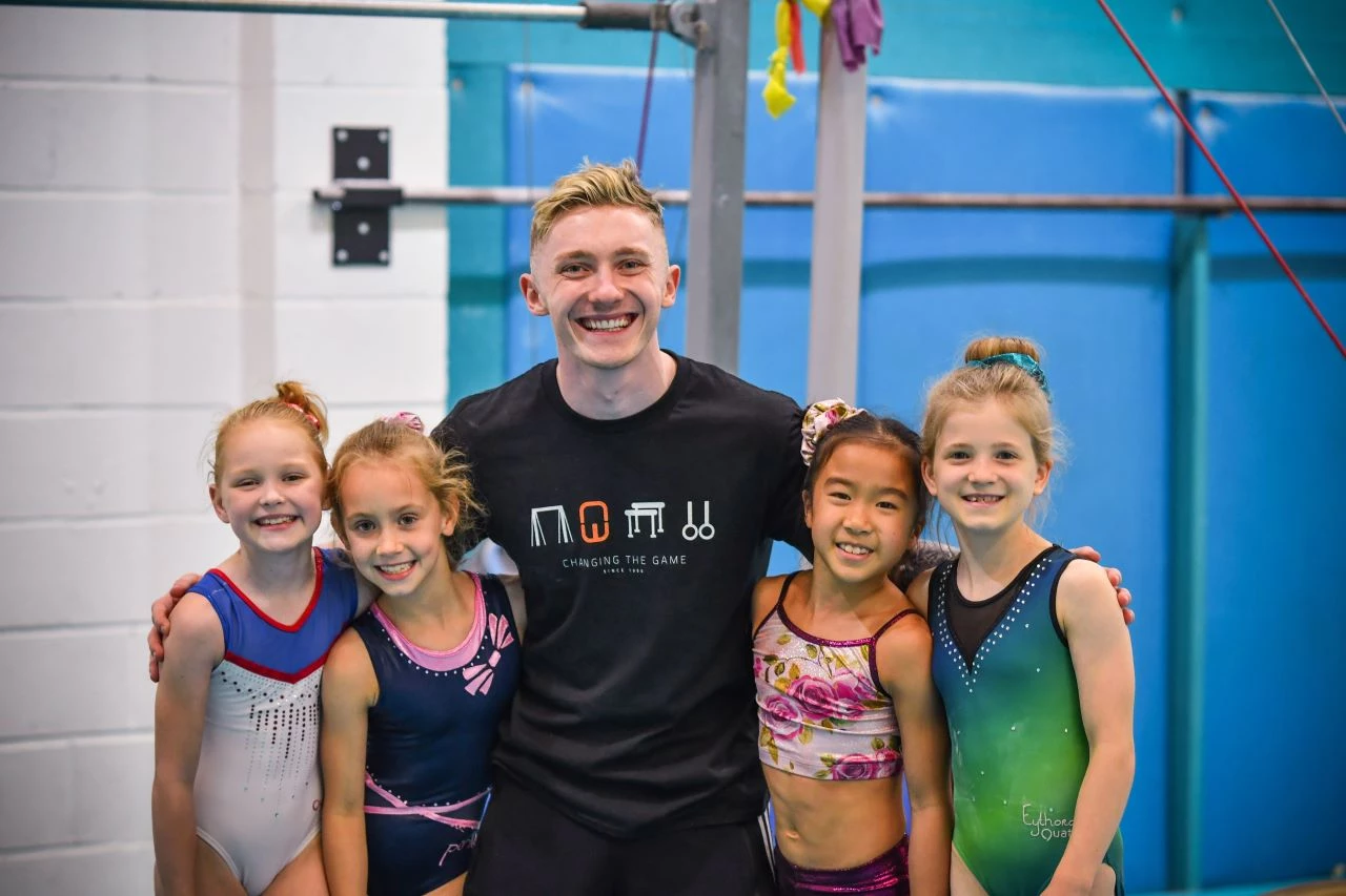 Nile Wilson and some young gymnasts