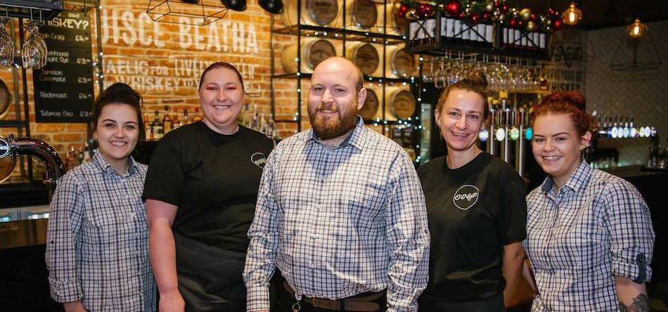 General manager Stephen Winstanley (centre) with members of his team