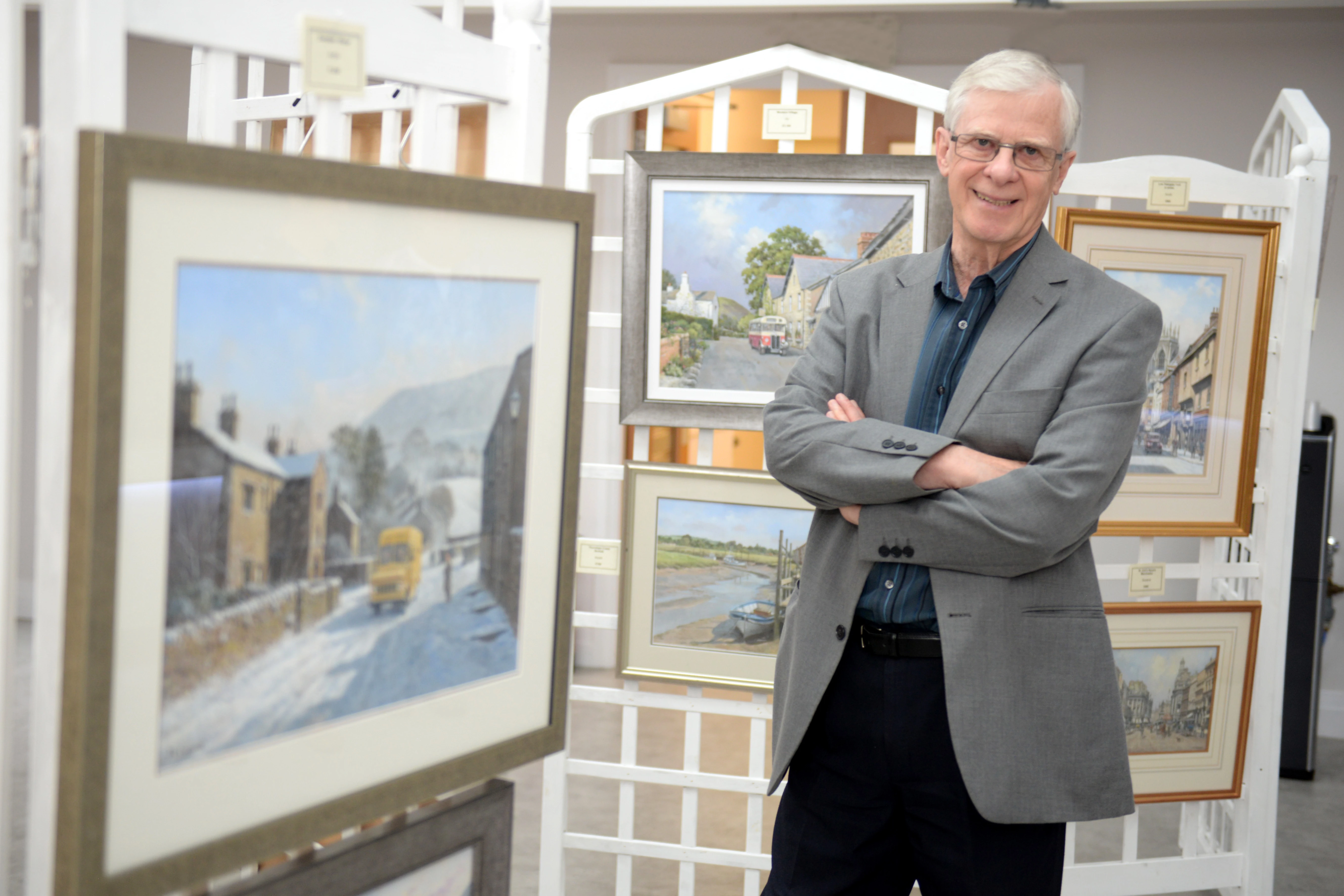 John Chapman with some of his paintings