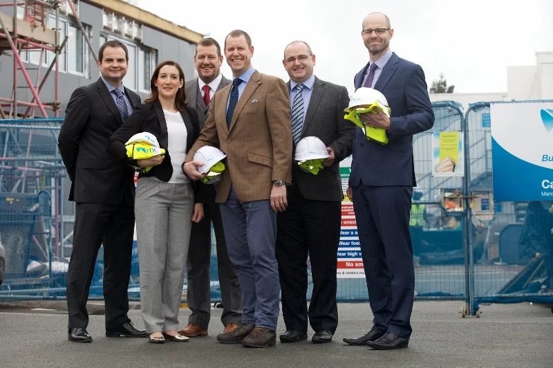 David Lowe in the brown jacket is pictured with the rest of the MC Construction board