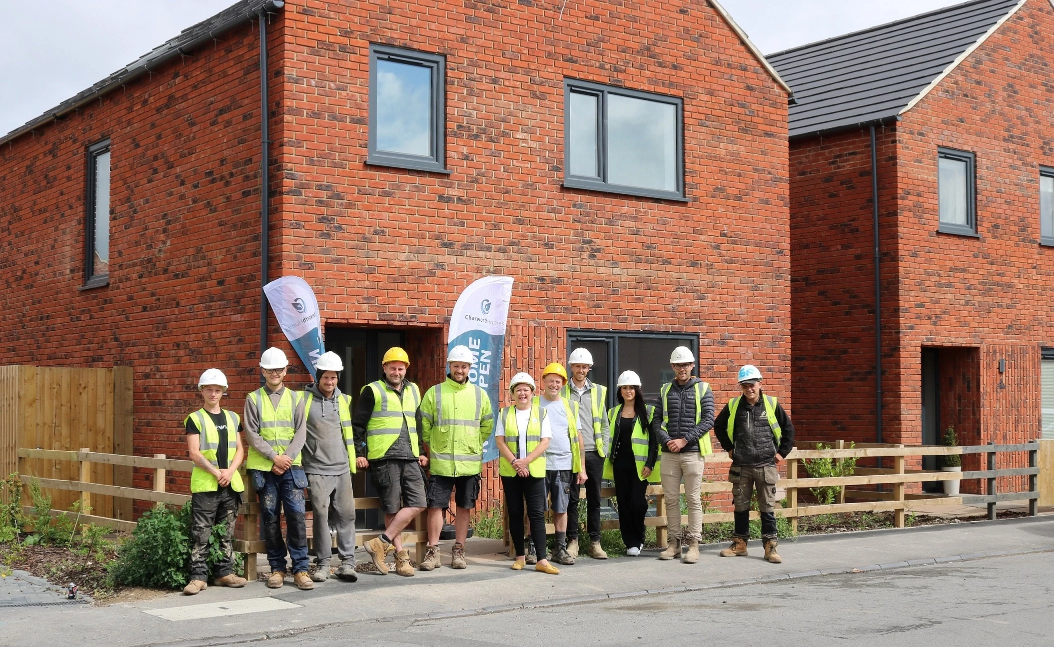 The Charworth Homes team, including Director James Pearson (2nd from right), new site manager Dan Steeper (4th from right) and site manager Tom Snowden (7th from right).