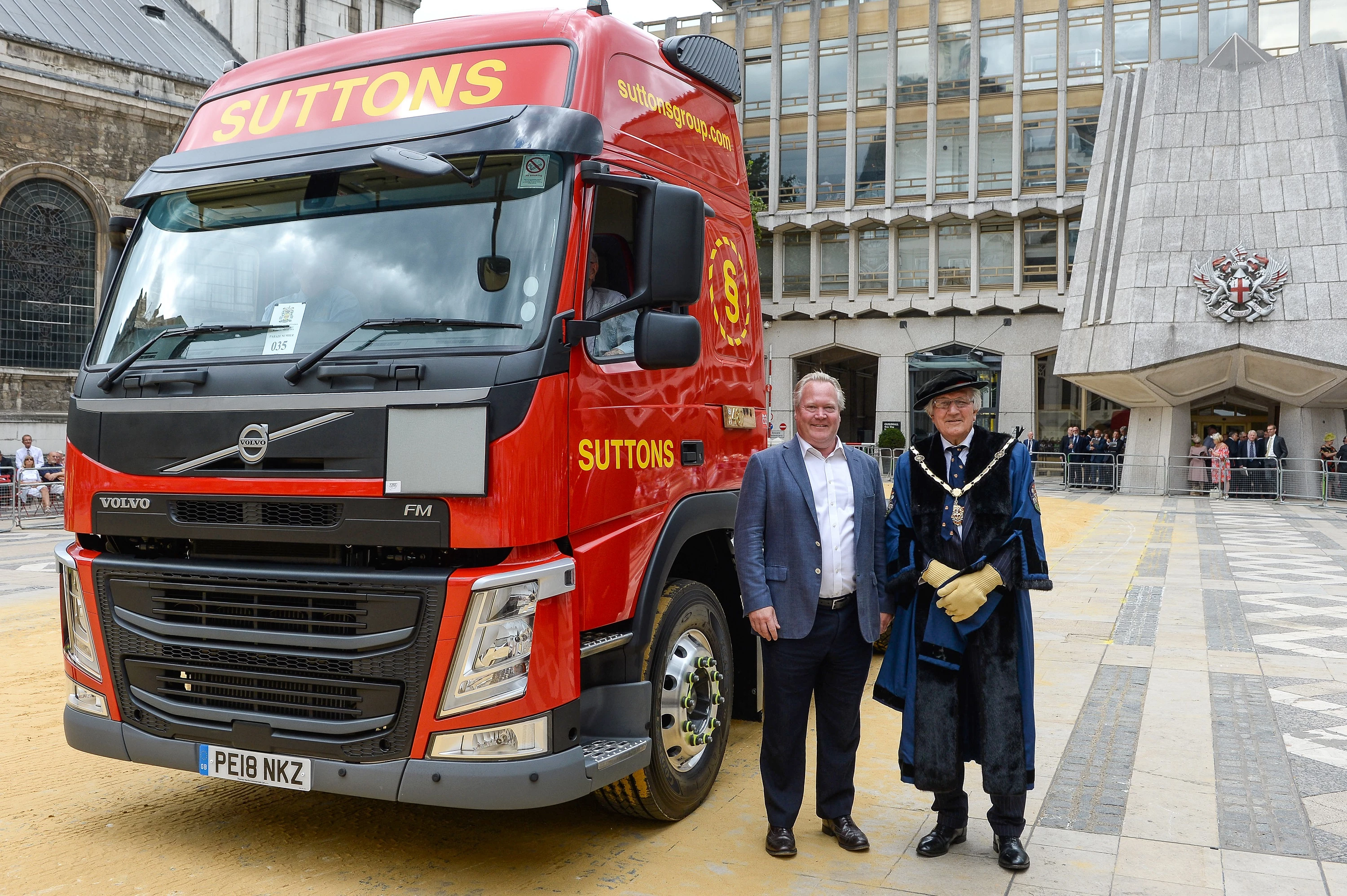 John Sutton, CEO of Suttons Group and Patrick Marsland-Roberts TD, Master Carman, next to one of Sutton’s newly branded trucks at this year’s Cart Marking ceremony.