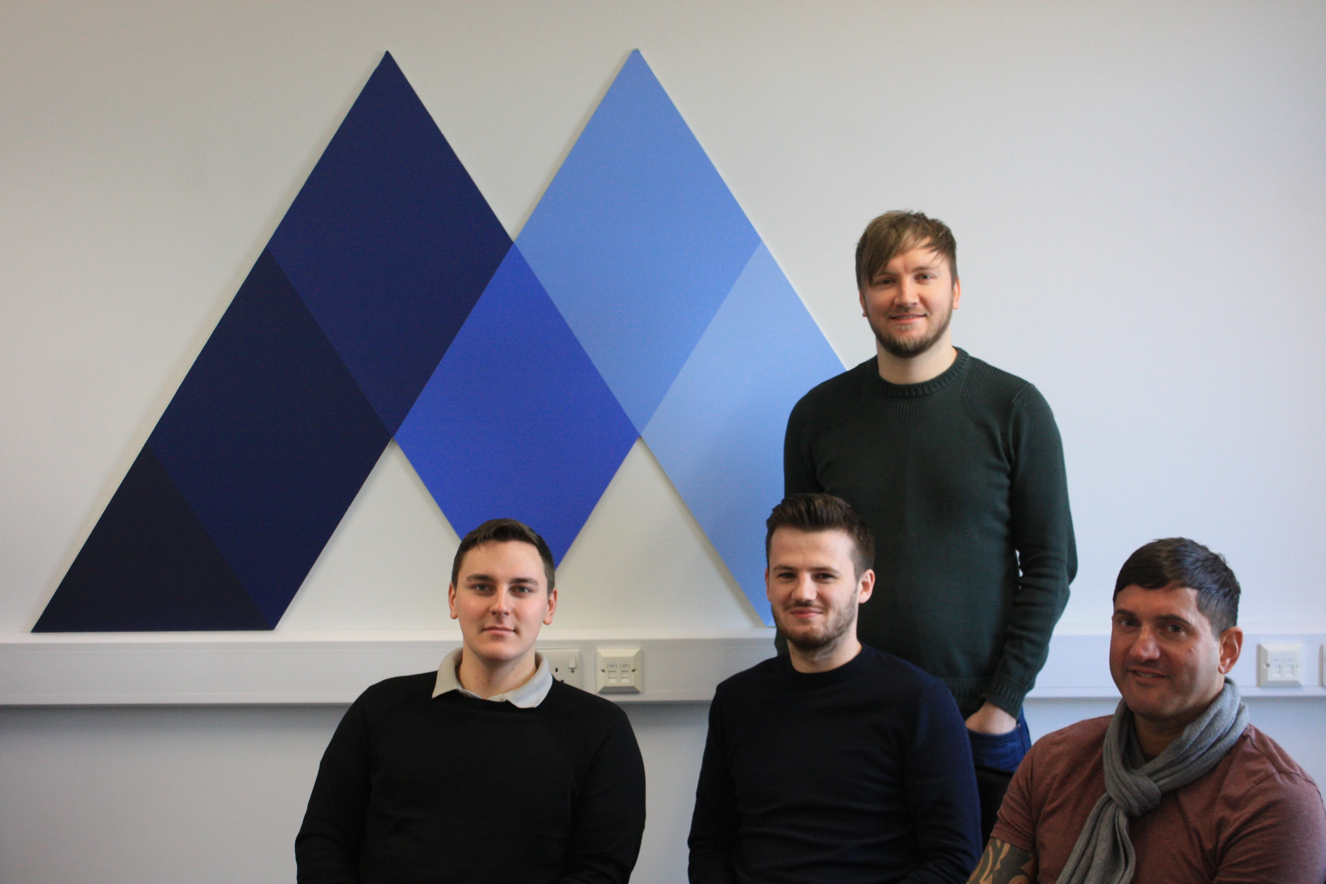 Richard Graham, Joe Foley & Adam Petson (left to right) sat with Head of Paid Search Robert Jackson.