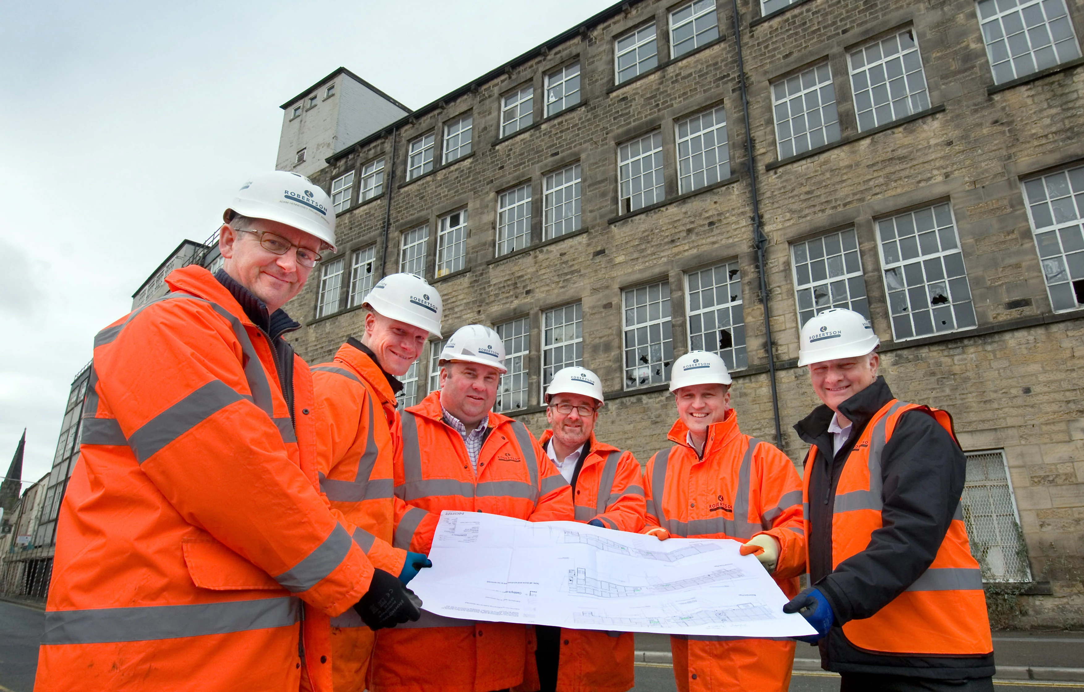 From left, Adam Hennesey, project manager; Aaron Scrivens, assistant site manager; Chris Duffy, senior project manager; Steve Hooker, commercial director; Dirk Pittaway, Robertson NW managing director; and Peter Greaves, operations director