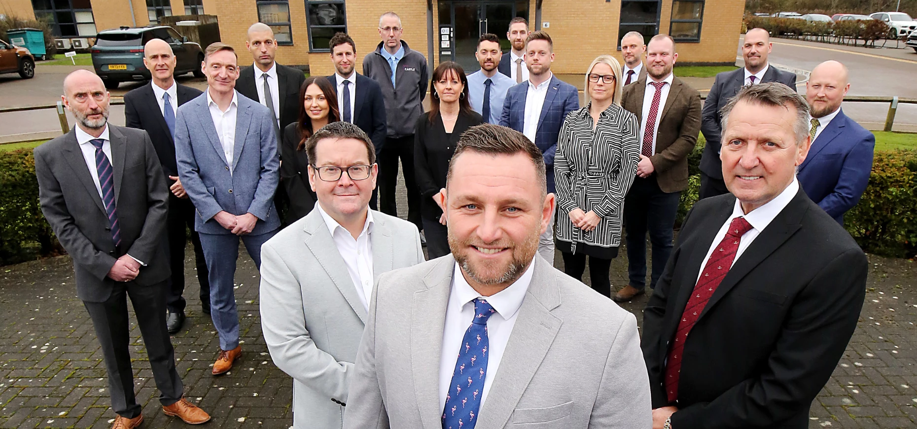 Technical director, Simon Groom, managing director, Andew Dawson and CEO, Tony Lister, with members of the senior management team.