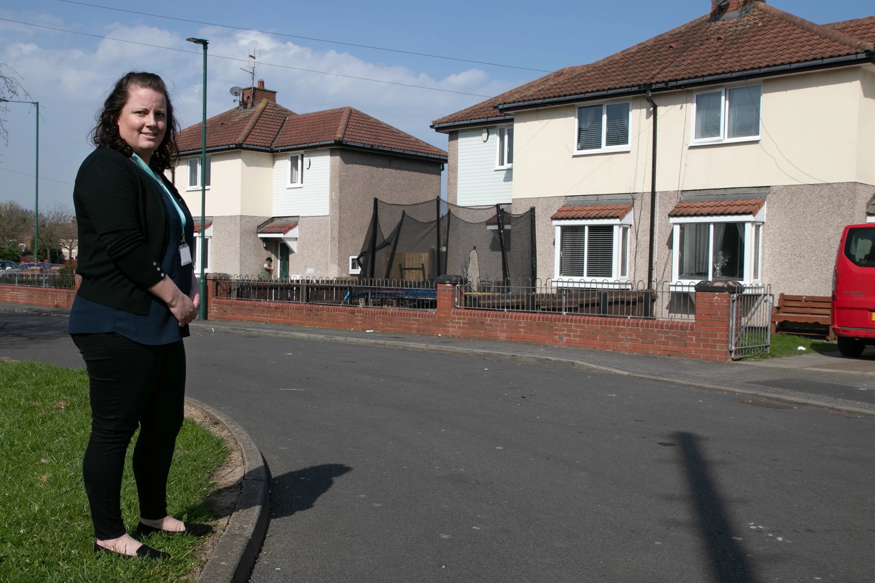 Beyond Housing Asset Project Manager Paula Aungiers pictured outside some of the homes with recently installed windows and doors.