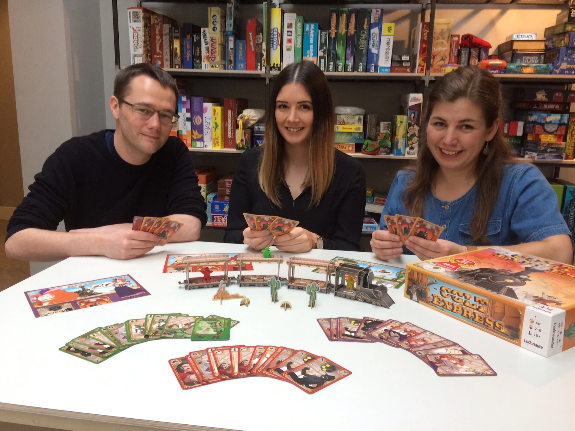 Laura Sanderson (centre) with Andy and Ruth Haigh at Treehouse Board Game Cafe.