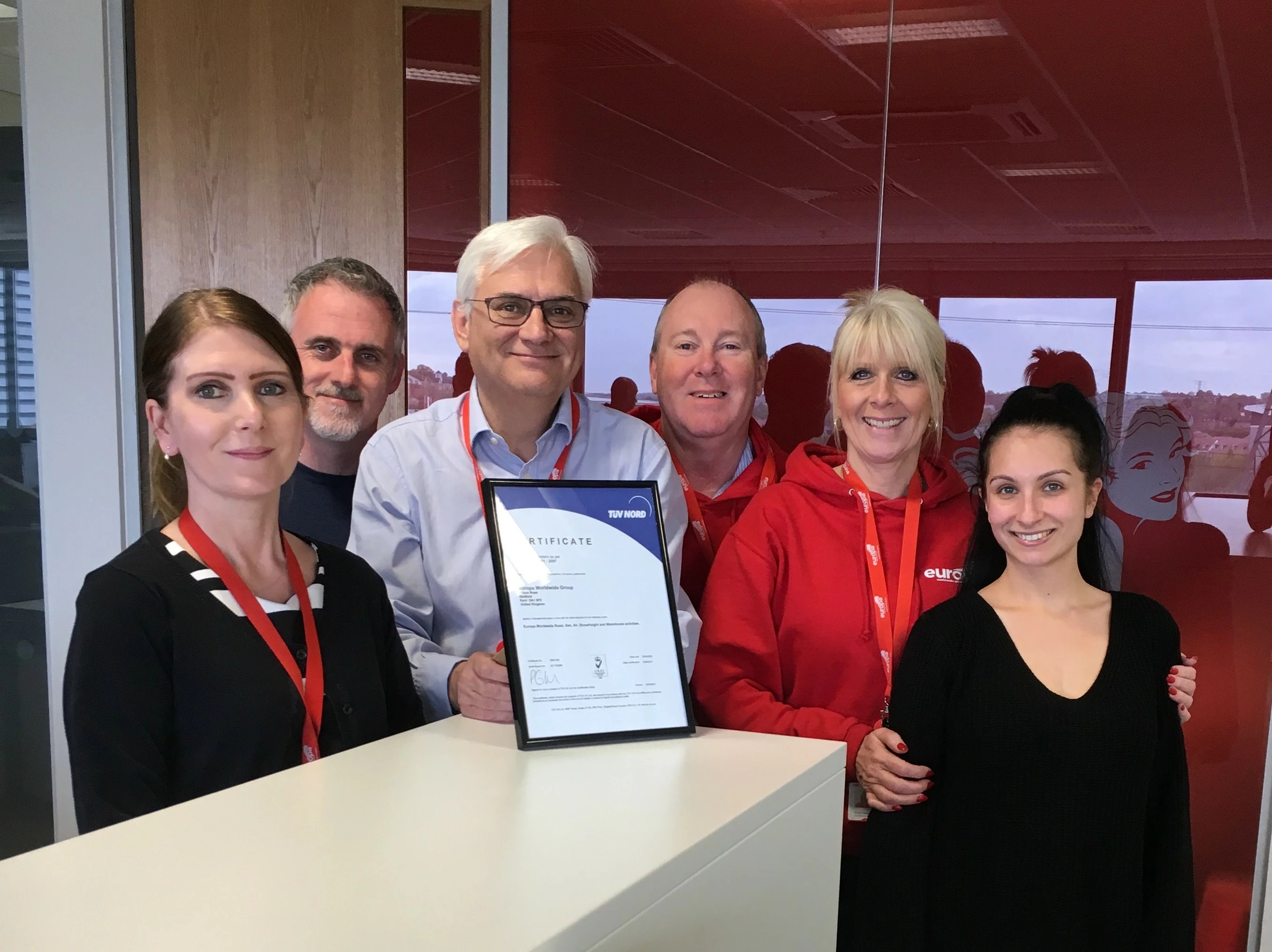 Carl Potter, centre, with accreditation certificate