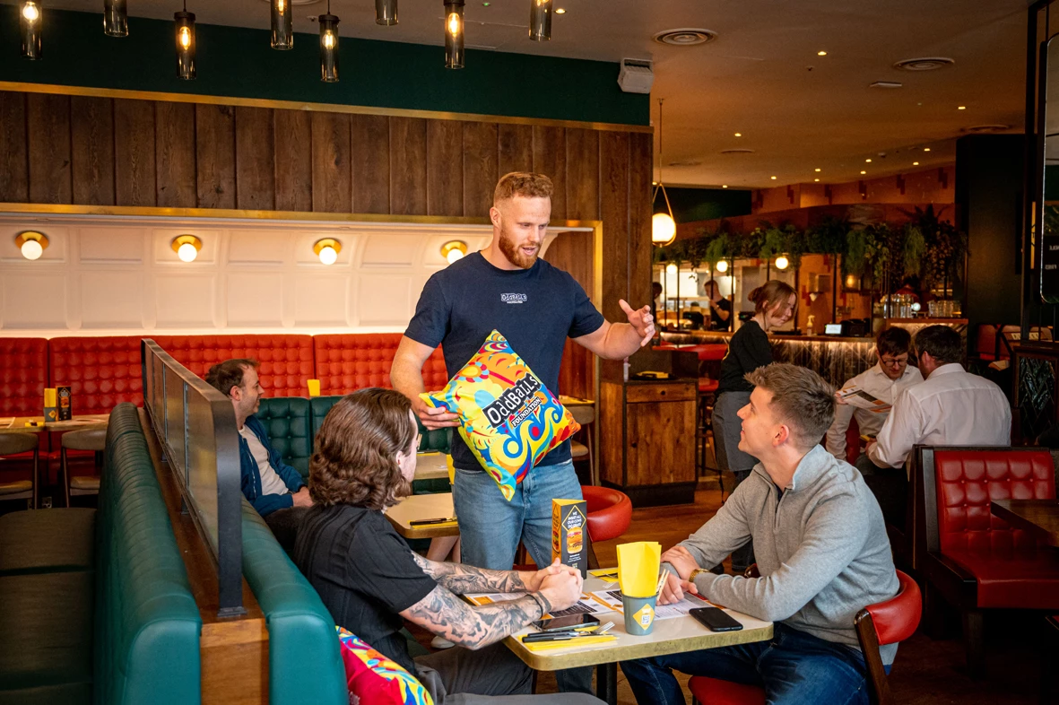 George Hobbs of The OddBalls Foundation talks about testicular cancer with Gourmet Burger Kitchen customers