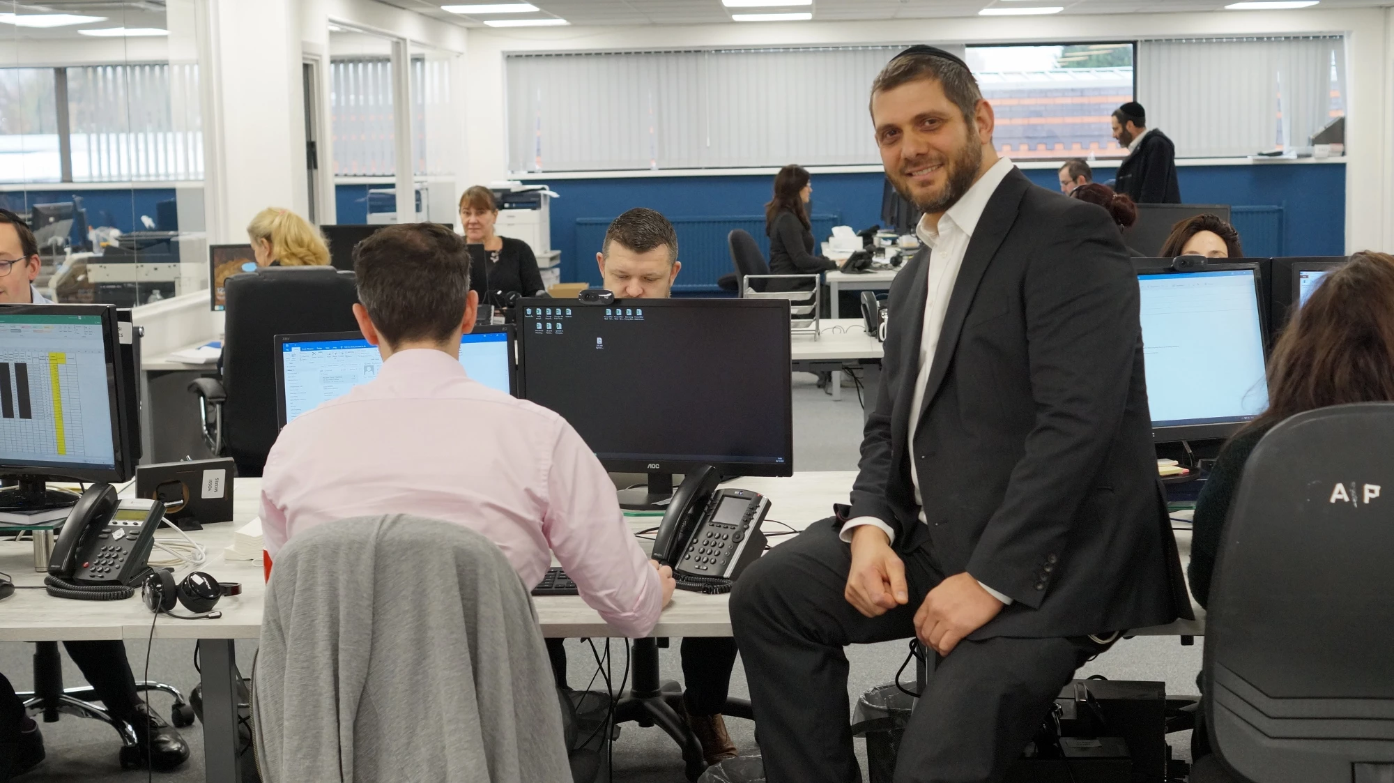 Joel Debson, seated, at the new offices