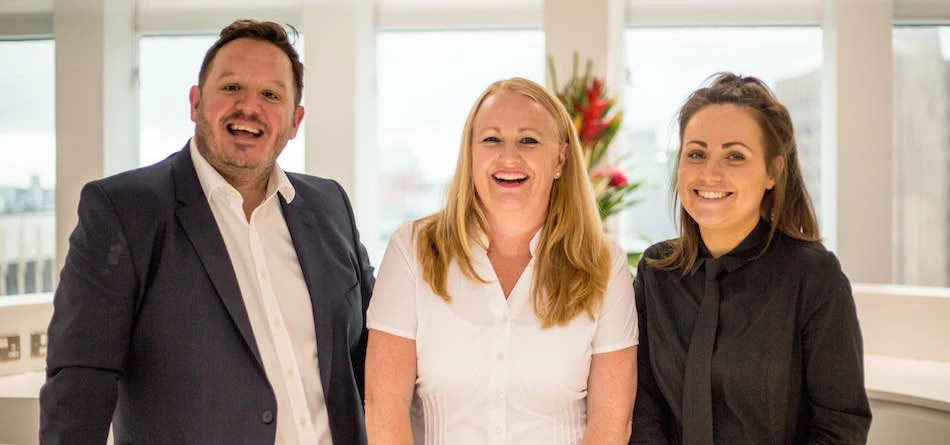 L-R: Toby Holt and Amanda Hesketh with a member of their team