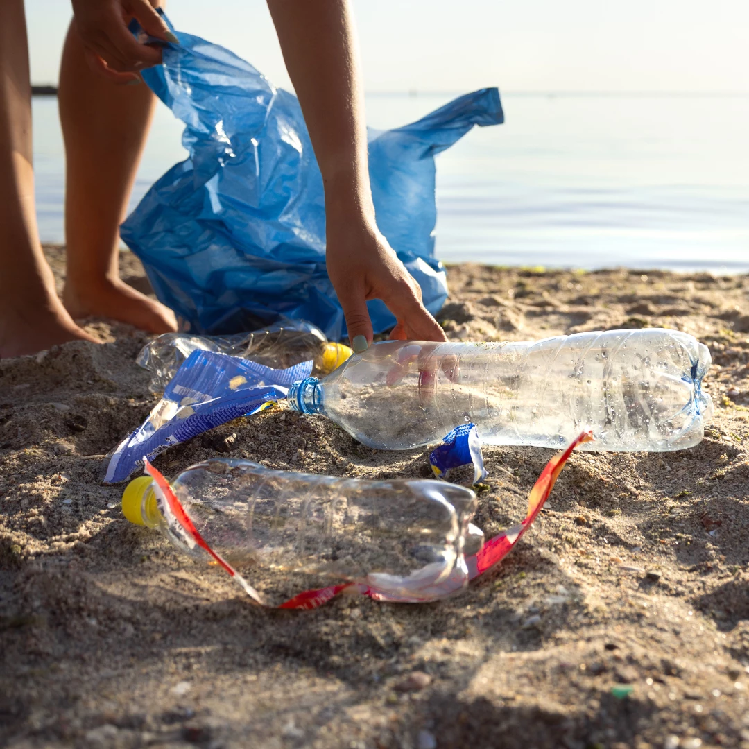 A person picking up plastic.