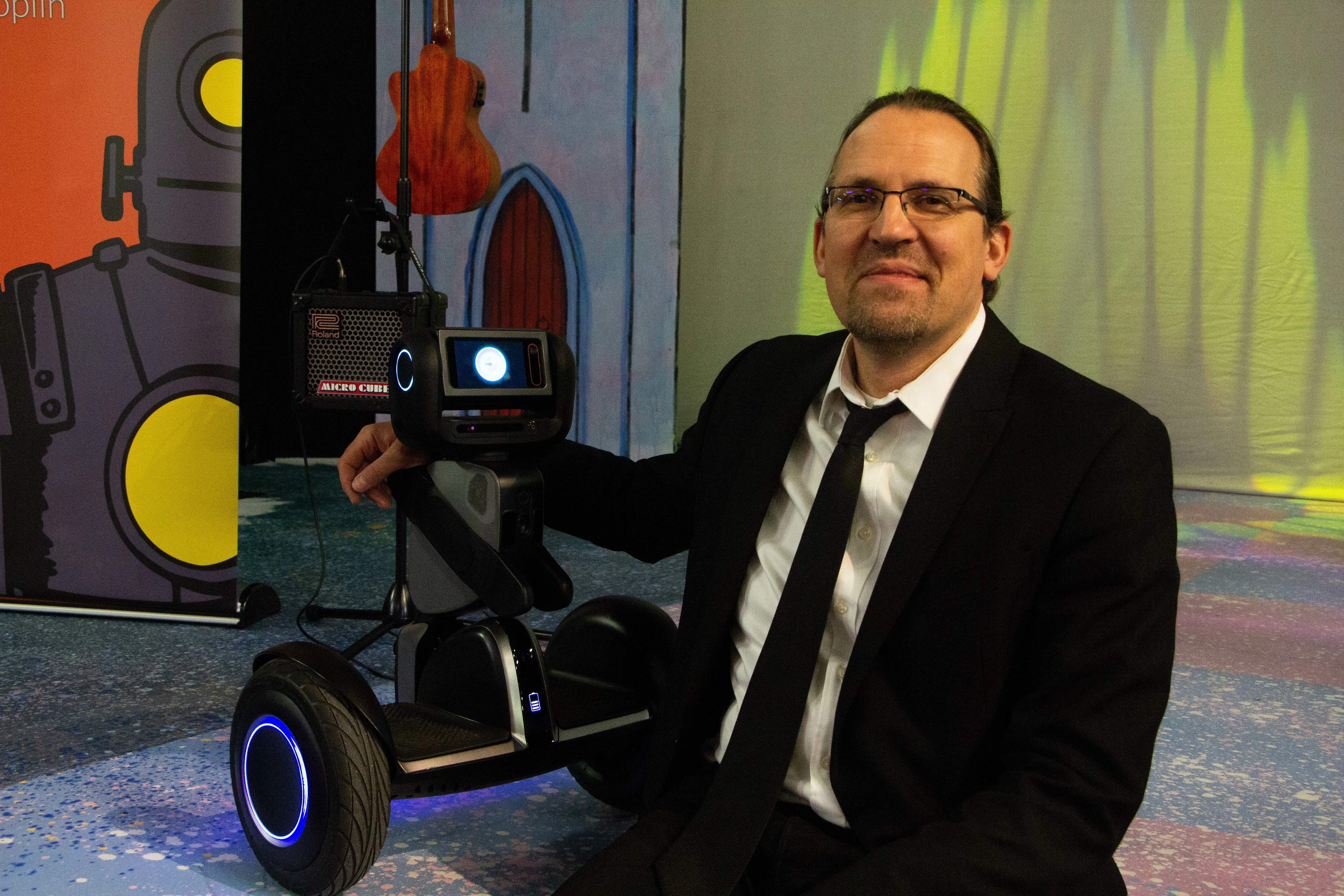 Technology guru Dave Coplin with his robot Loomo, in Middlesbrough College's Hazel Pearson Theatre