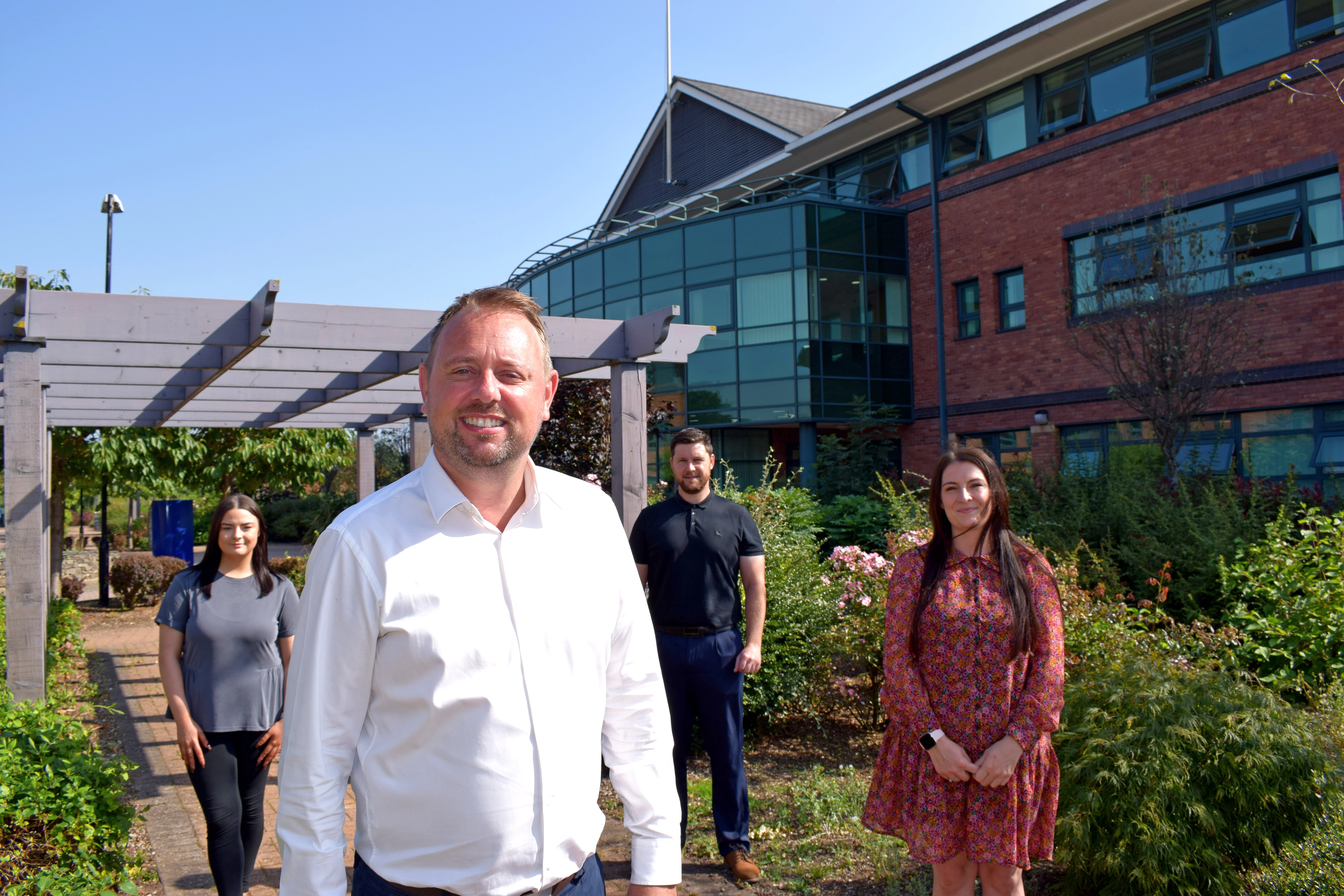 Photo shows: Andy Hughes, Chief Executive of Water Plus with some of the staff who work for the water retailer. 