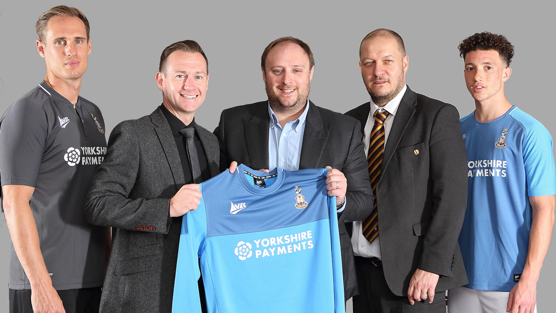 James Howard (centre), MD of Yorkshire Payments, with James Mason (centre left), COO at Bradford City Football Club, Michael Shackleton (centre right), Commercial Manager and Bradford City players.