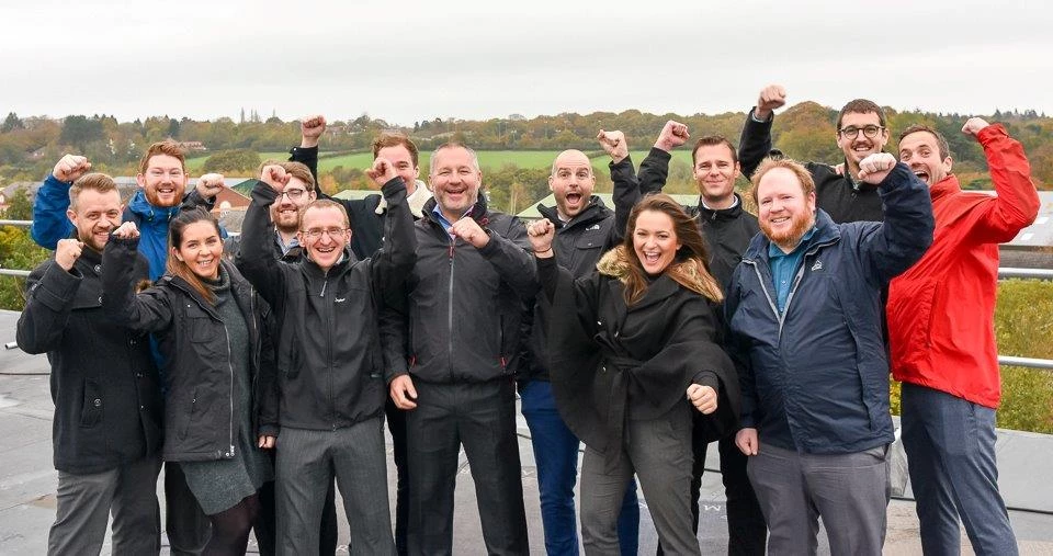 Aiming high for charity: Paul Parkinson, centre, with Synergy team members.  