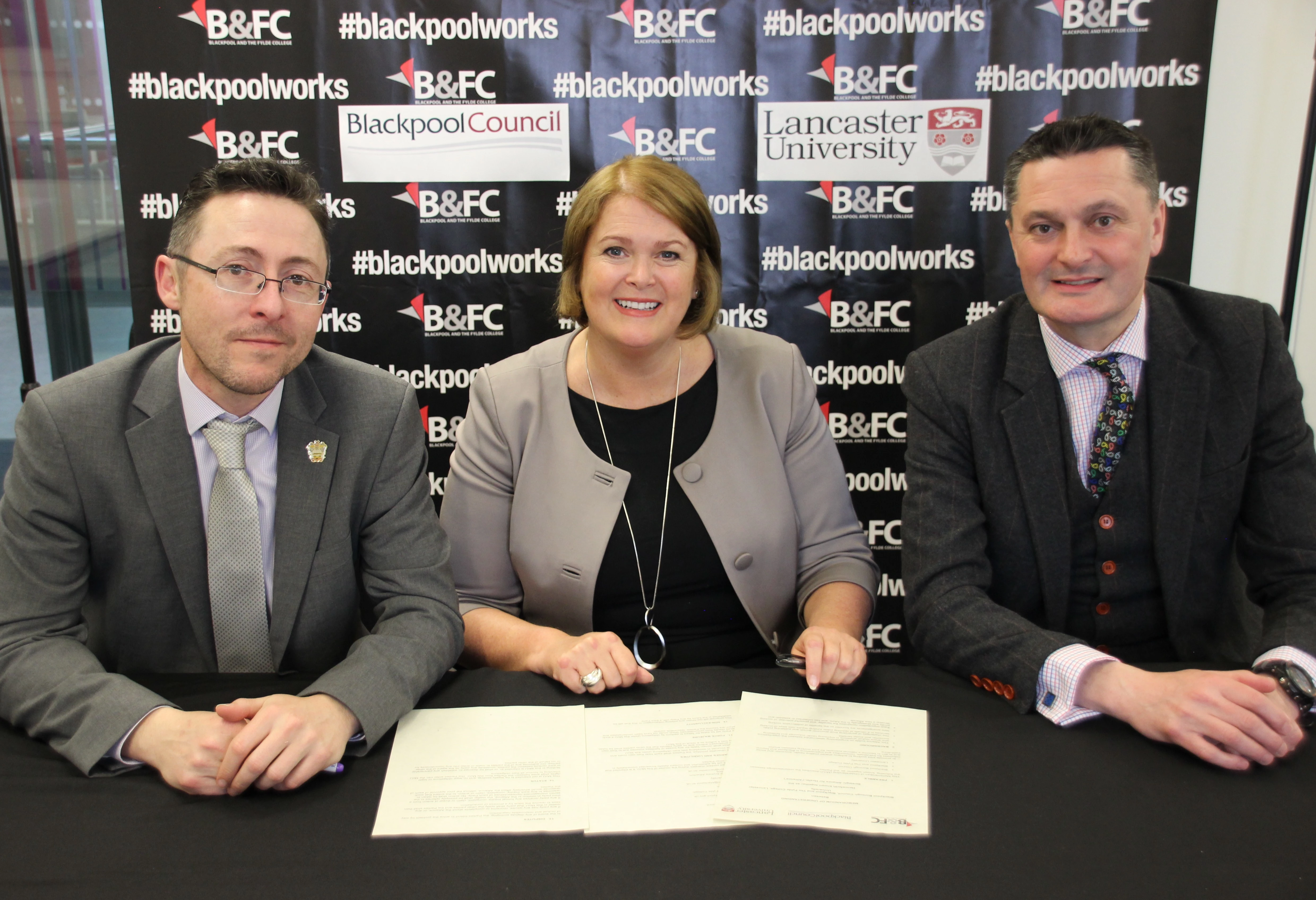 The signing of the Memorandum of Understanding with (l-r) Blackpool Council Chief Executive Neil Jack, Bev Robinson OBE and Prof Andrew Atherton from Lancaster University