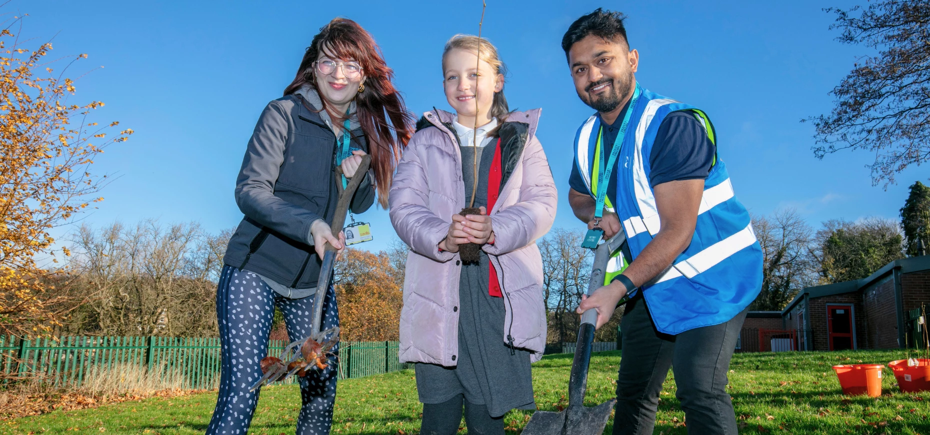 Metrocentre Gateshead volunteers work with local school children to plant trees.