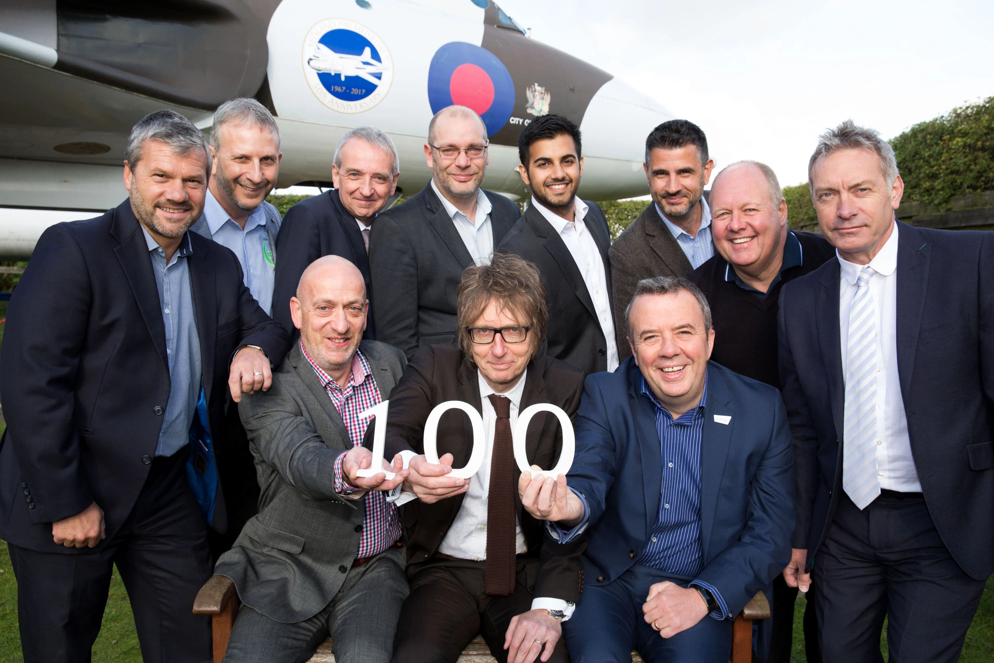 Jason Aldridge (front, centre) with Michael Mogan (front, right) with members of the Coventry and Warwickshire Aerospace Forum.