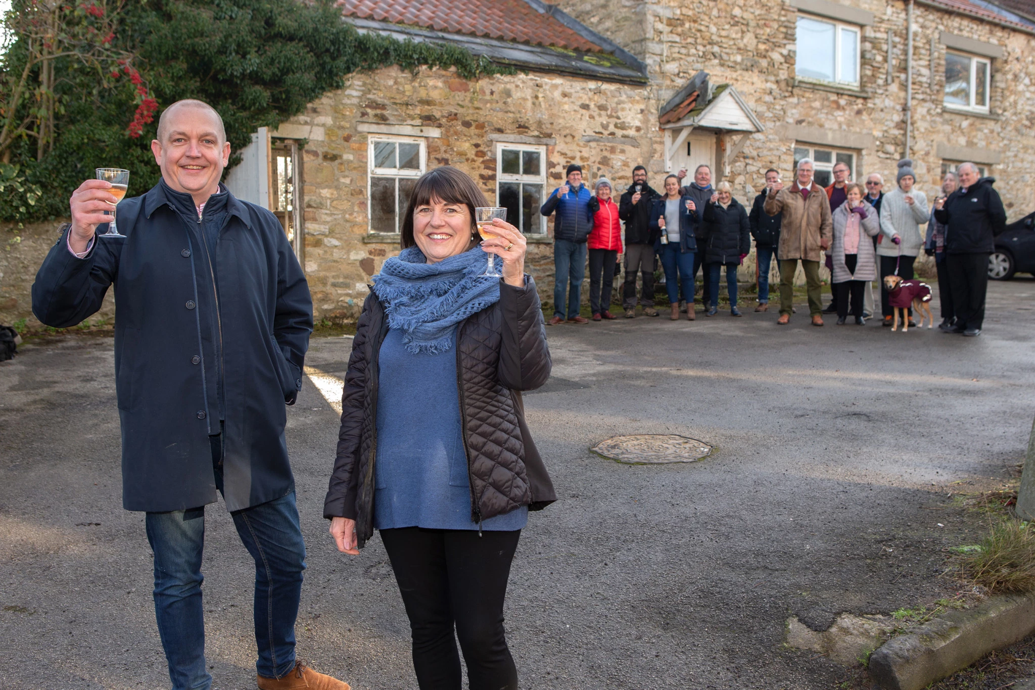 (L-R): Giles McCourt, associate solicitor in the real estate team at Muckle LLP, Carol Wilkinson, chair of the SCPS and the rest of the society celebrating outside The Travellers Rest.