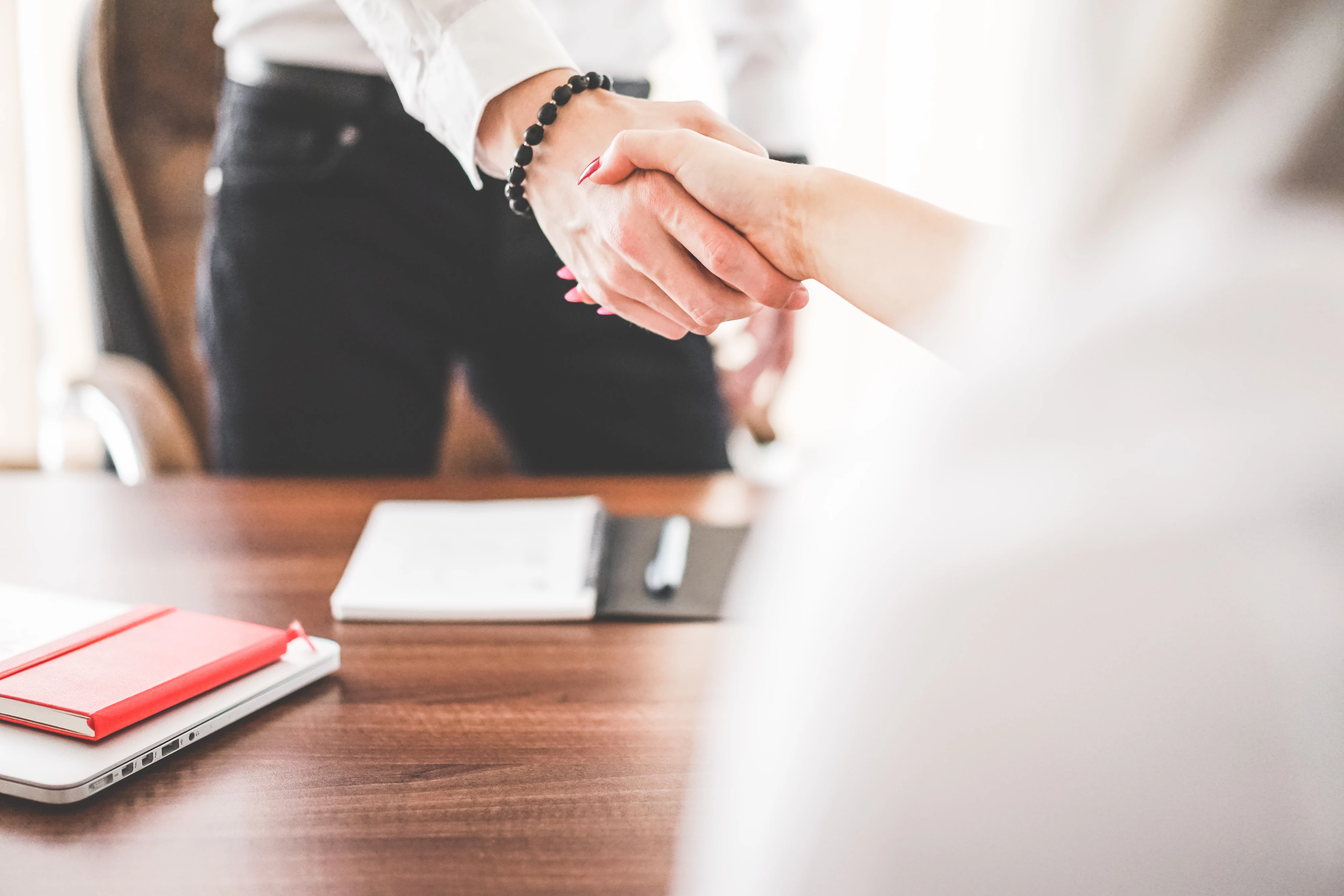 business man and woman handshake in work office