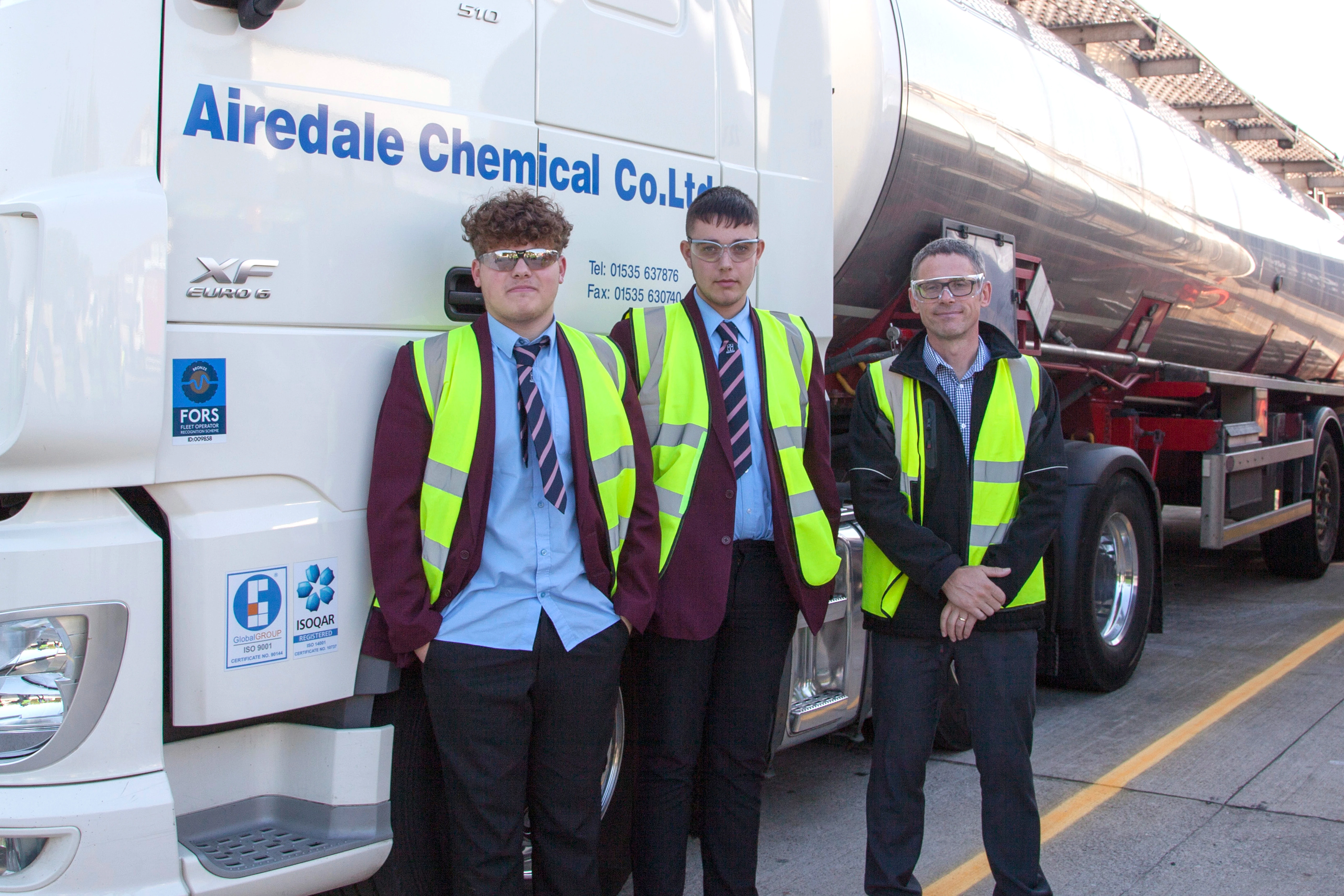 Airedale Chemical's operations director, Dan Fox, with pupils from Keighley's Holy Family Catholic School