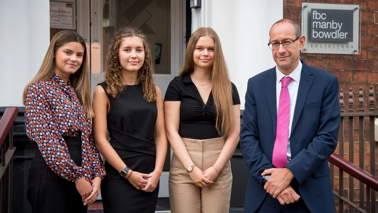 Apprentice solicitors (l-r) Lara Sidell, Hannah Barker, Emily Shenton pictured with FBC Managing Director, Neil Lloyd