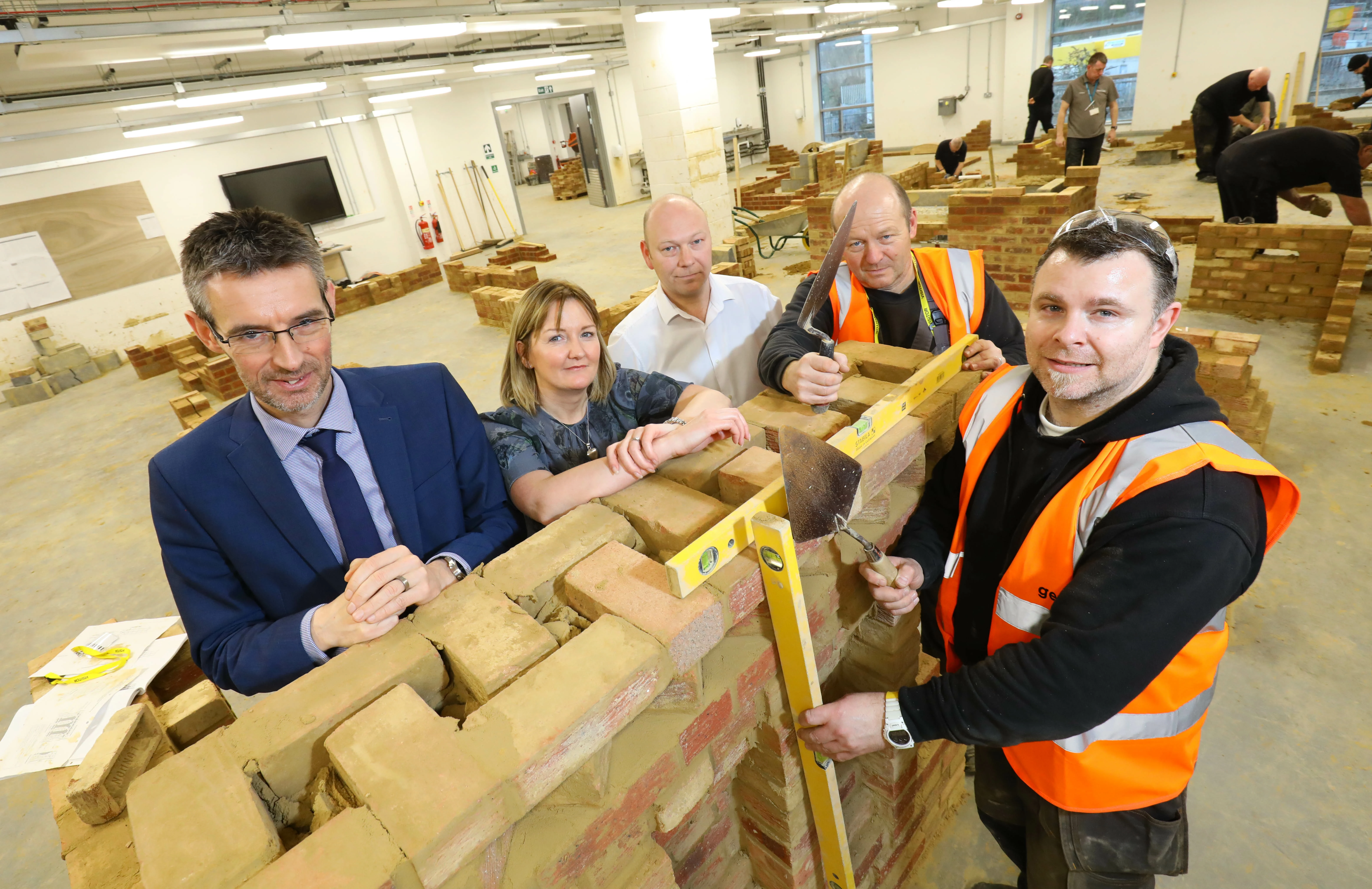 Sunderland College’s Iain Nixon joins Gentoo’s Diane Carney (deputy director for repairs and maintenance), Alex Hammond (head of learning and organisational development), joiner Gerry Davies and David Ditchburn, gas service engineer    