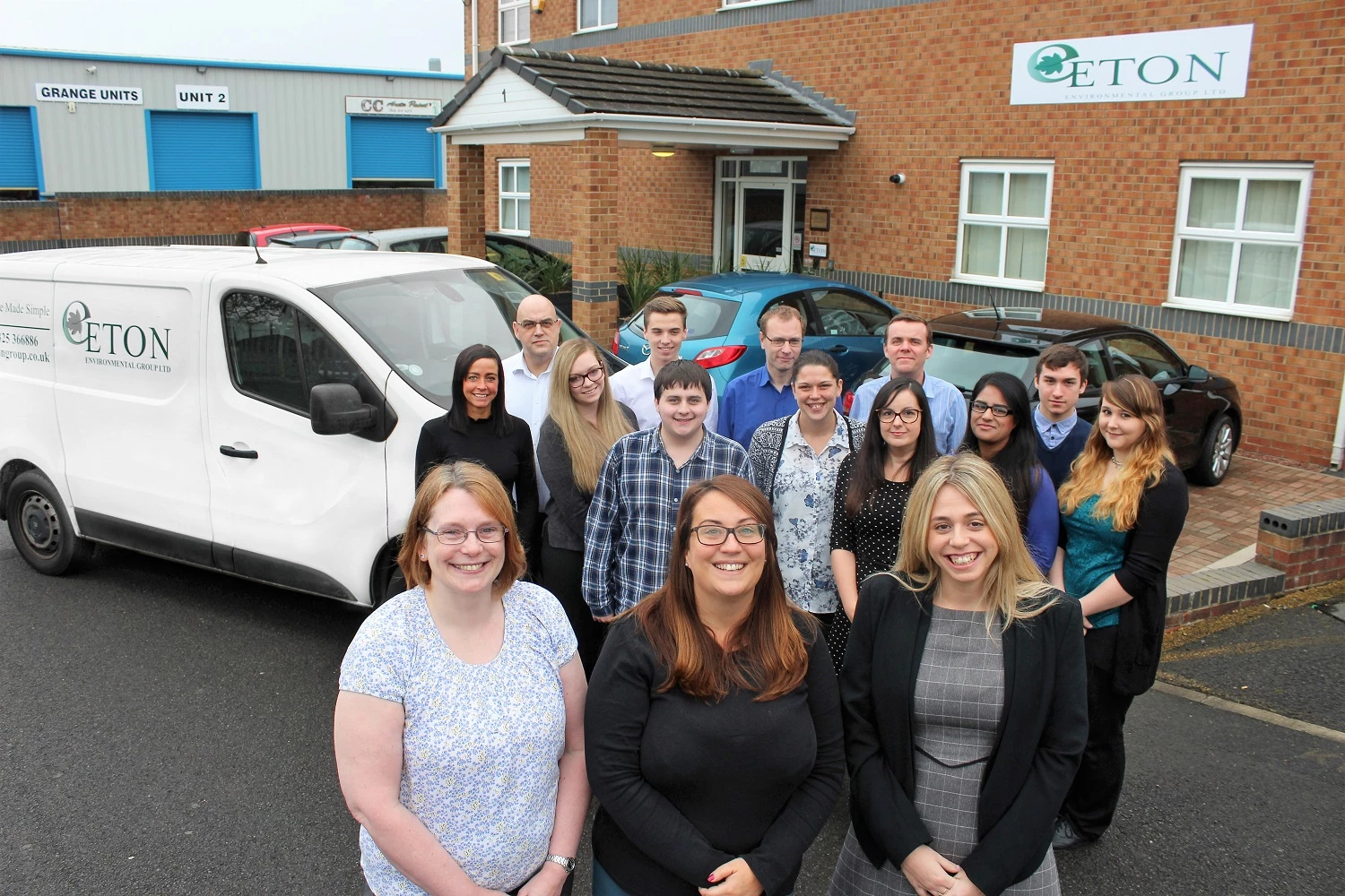 Staff outside the new offices of Eton Environmental Group