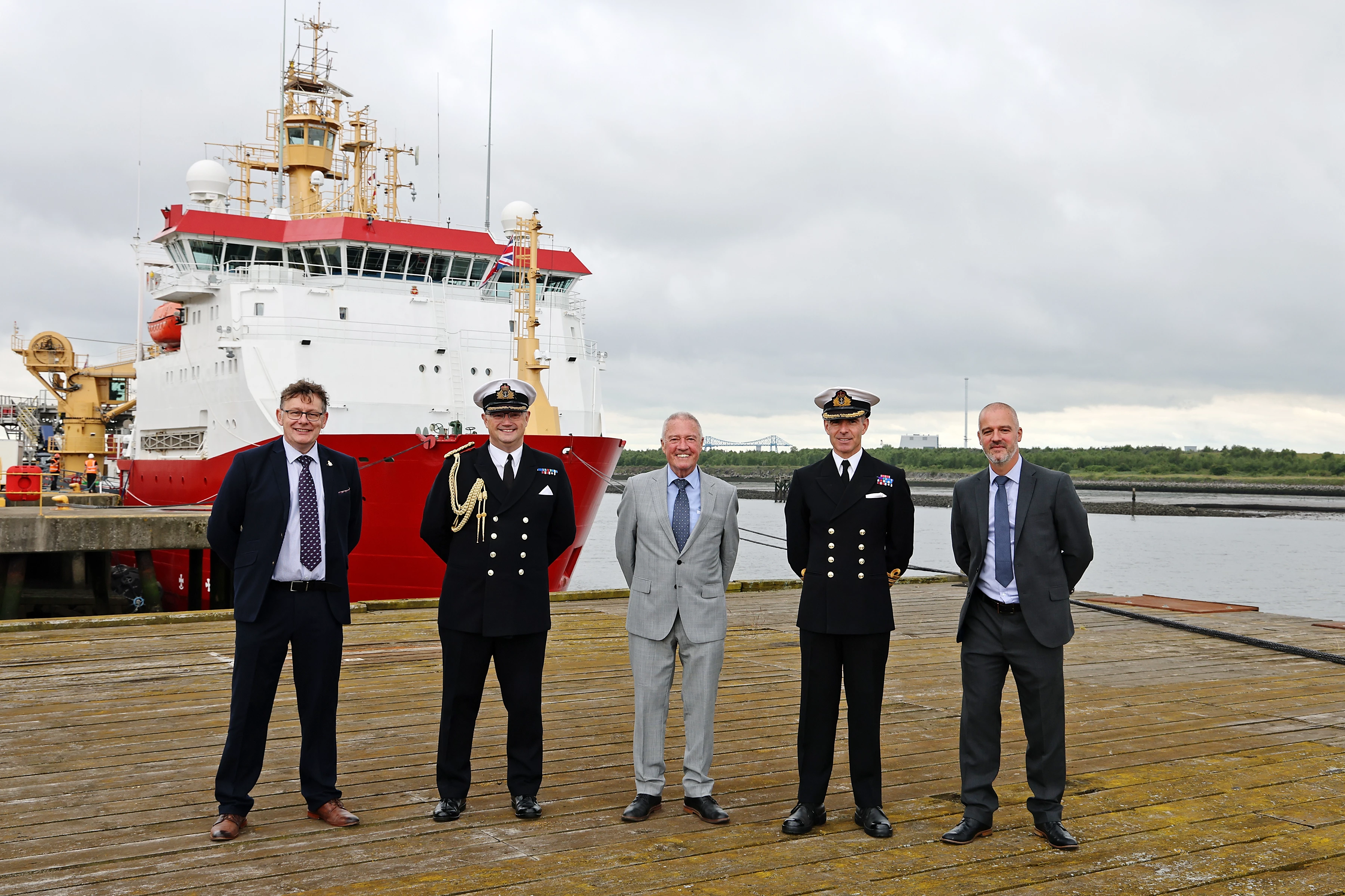  UK Docks' founder Harry Wilson with son and director Jonathan Wilson and operations manager Stephen Lee, welcome Commodore Phillip Waterhouse and HMS Protector Captain Michael Wood MBE to Teesside.