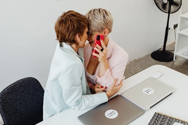 Two women sharing a secret