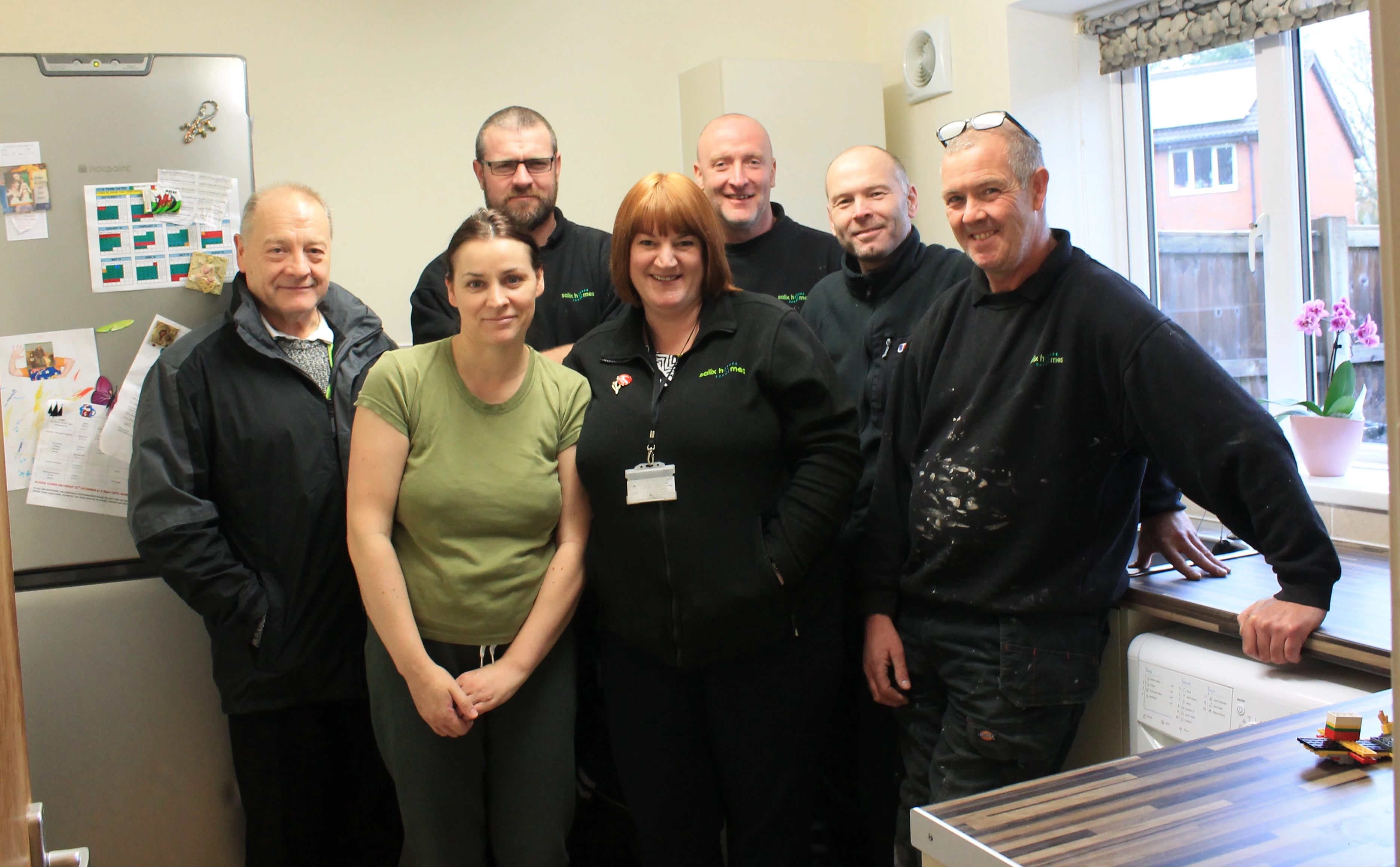 Happy tenant Deborah Banu with Salix Homes in-house Repairs and Maintenance Team