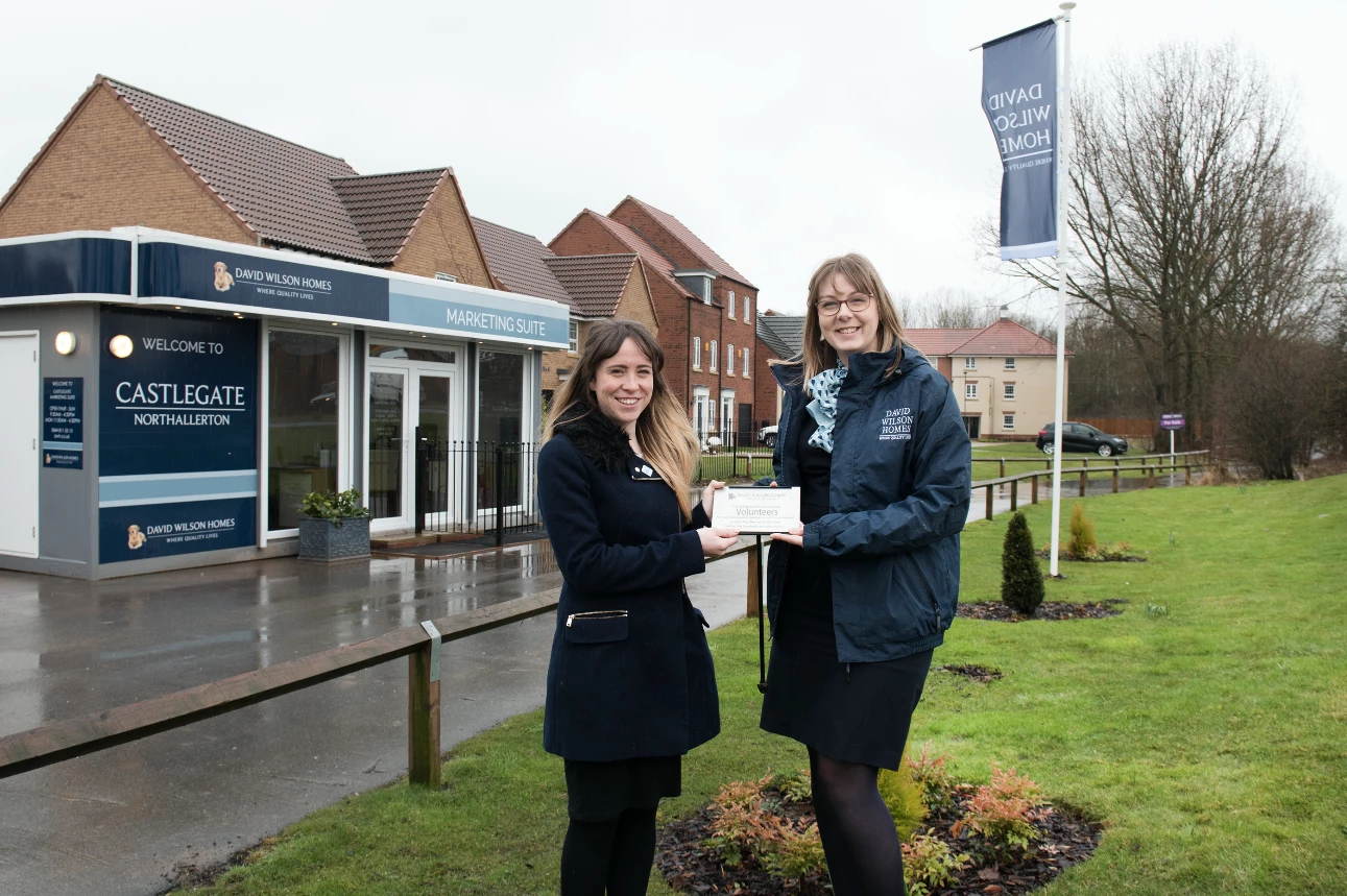 Area Project Officer from Sporting Memories Network Megan Hale with David Wilson Homes' Castlegate Sales Adviser Amy Howe