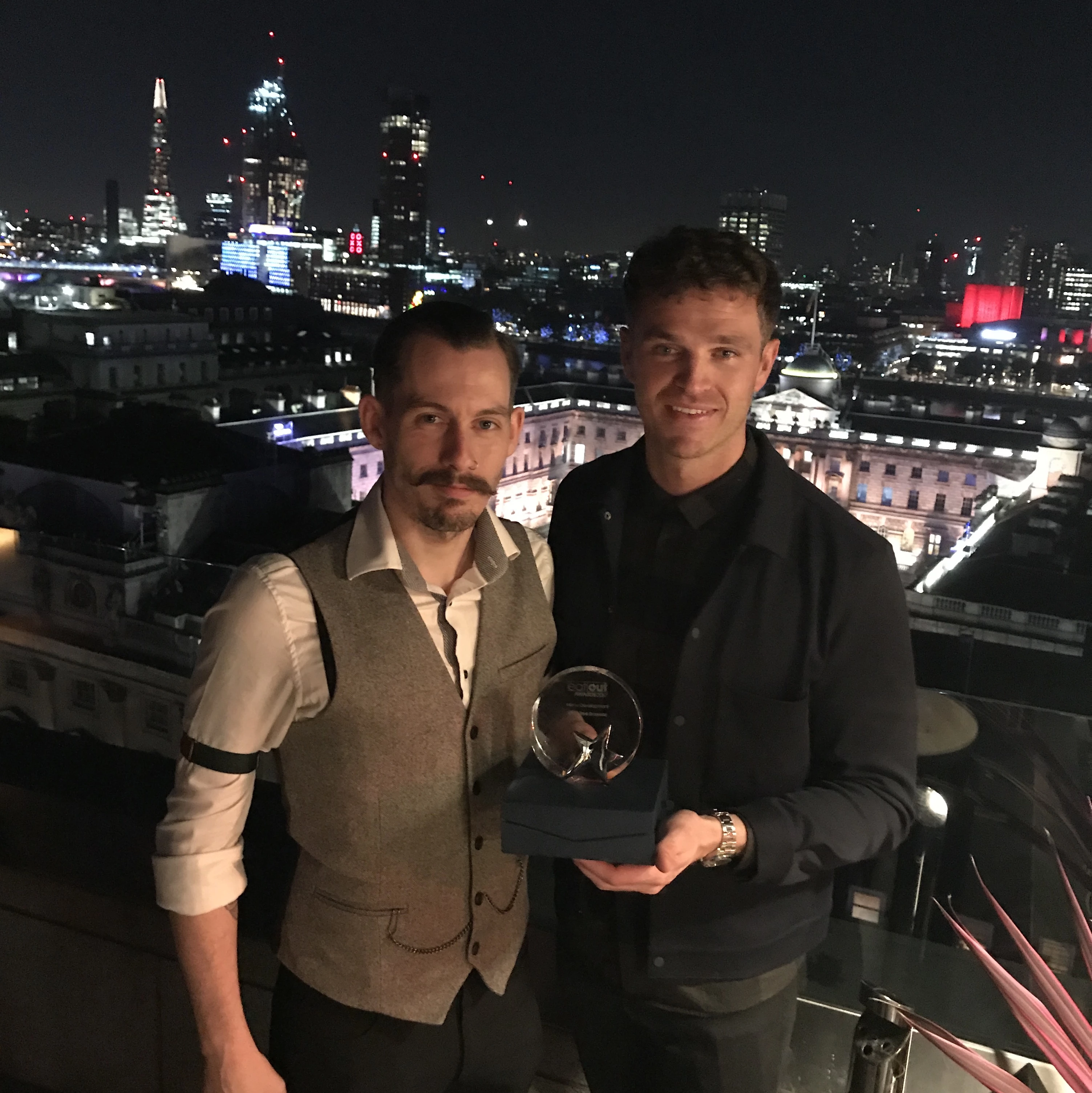 Head Trainer Danny Hobson celebrates the Eat Out Magazine Award win with Olive Tree Brasserie founder Dean Wilson.