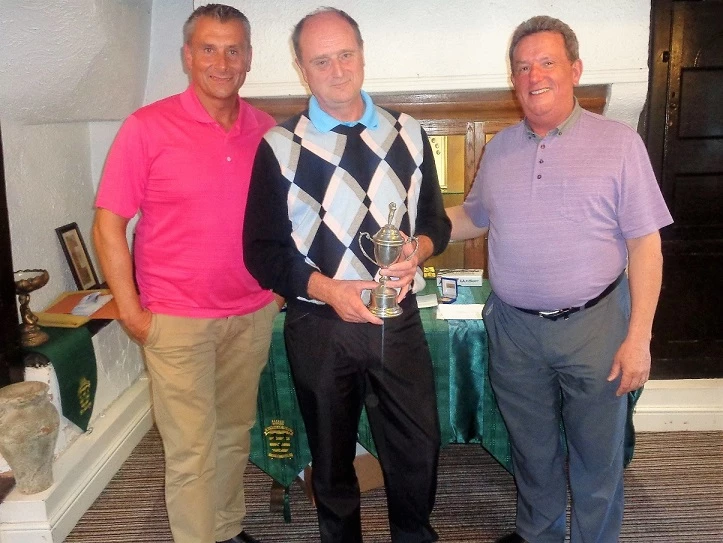 Dale Wright (left) and John Elmore (right) from Martin-Brooks, congratulate individual winner, David Foxcroft, at the firm's charity golf day. 