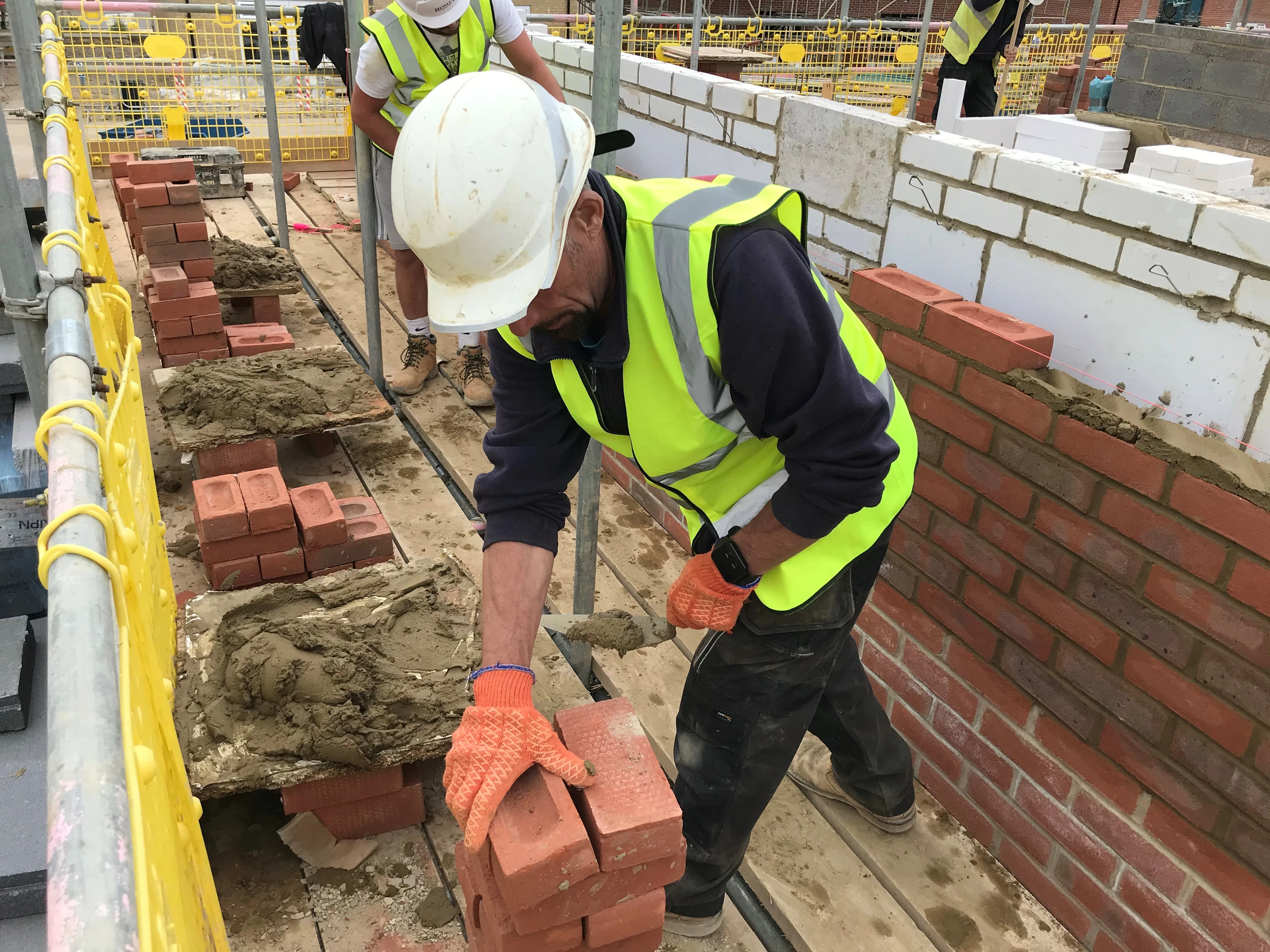 Site worker using One.site social distancing wristbands