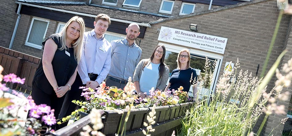 MSRRF Fitness and Therapy Team leader Deborah Davidson (left) and Fundraising Manager Dan Nelson (centre) with representatives of the UNW Charity and Communities Support Group (right)