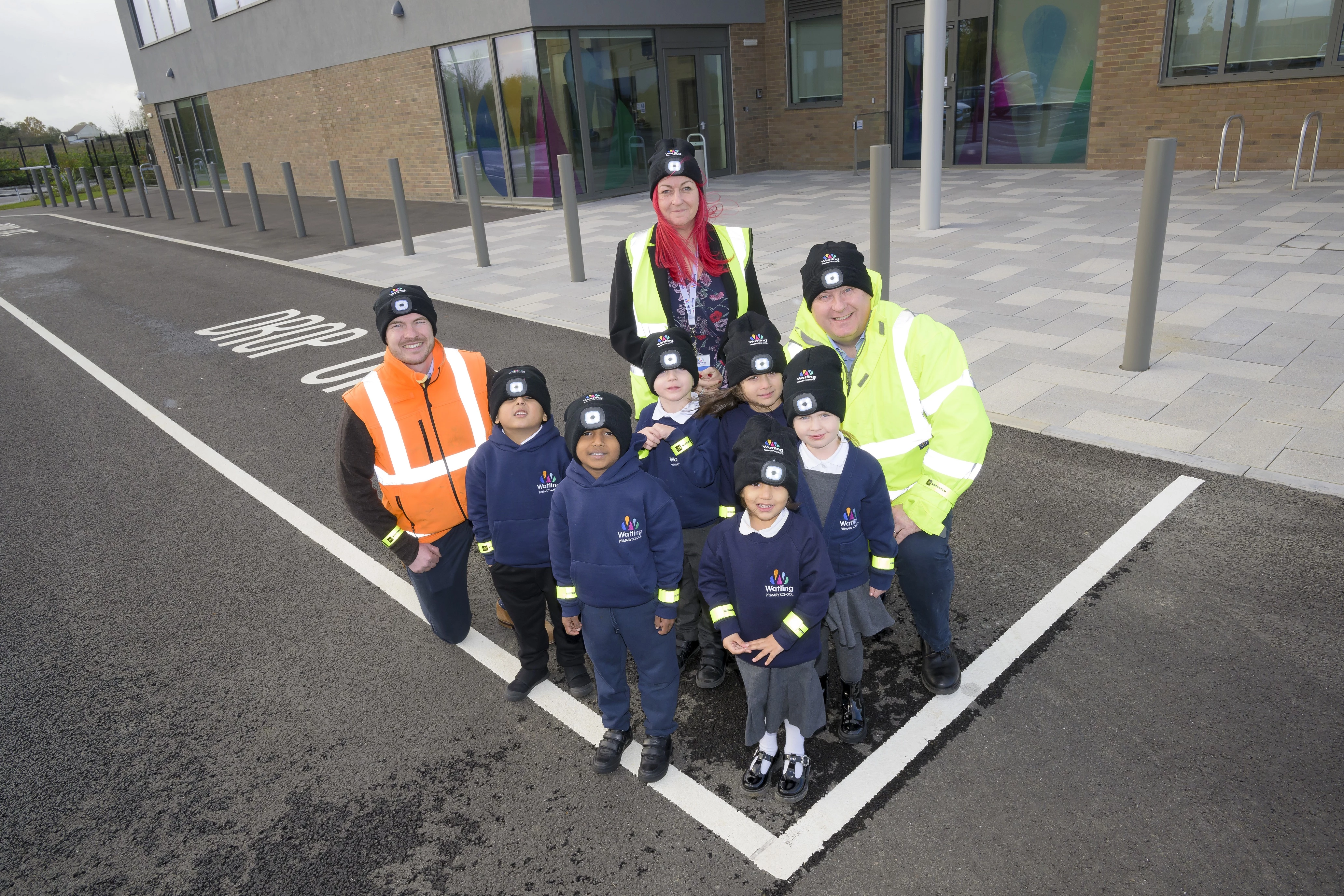 From the left, Simon Taylor of L&Q Estates with Vikki Pegg of Watling Primary School and Marcus Hill of L&Q Estates with pupils from Watling Primary School