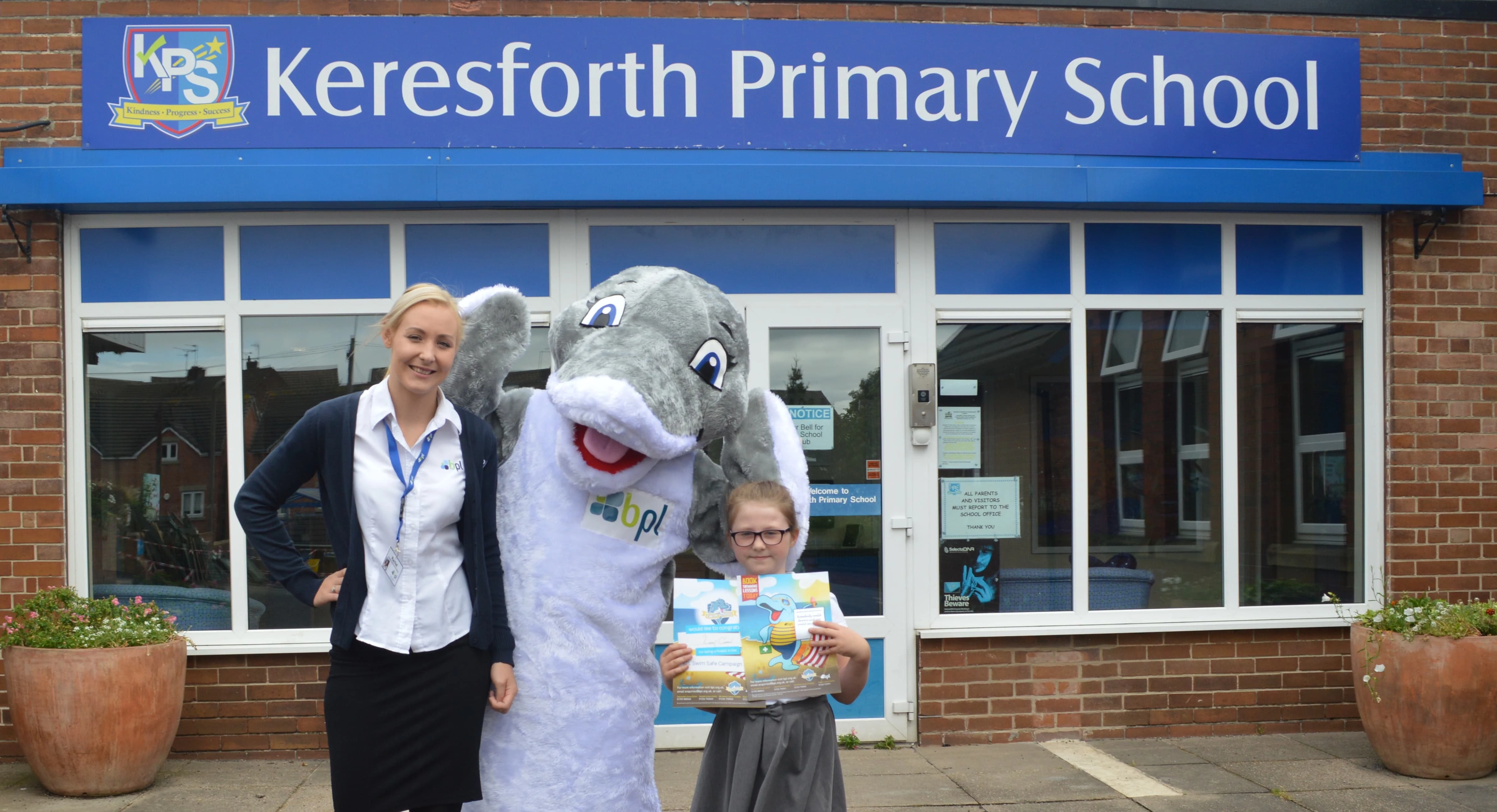 Winner Lacey Green with Derek the Dolphin and BPL swim ambassador, Rachel Kayser.