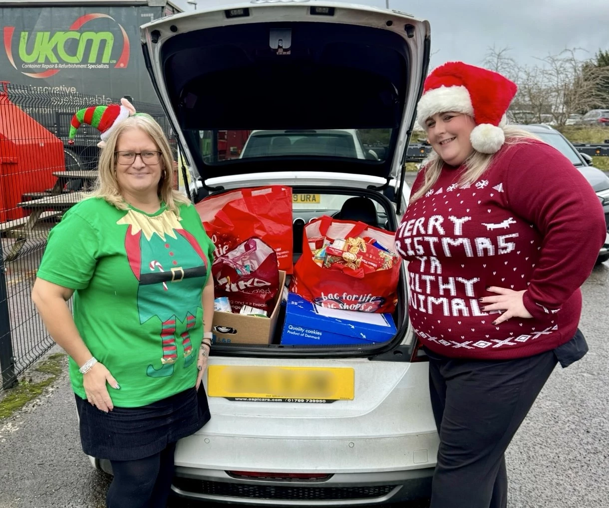 UK Container Maintenance team members with the food bank donation