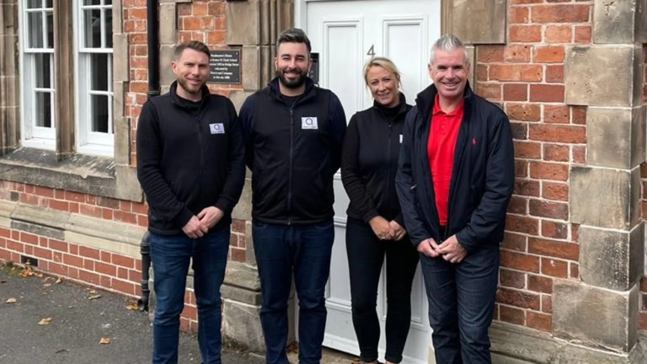 Alan Lewis from ASE, right, with Ben Wootton, left, and some of Q's Shrewsbury team who took part in last year’s Oswestry 10k event