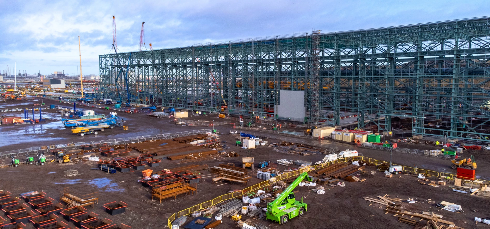 The first profiled steel wall covering going on to the SeAH Wind monopile facility at Teesworks