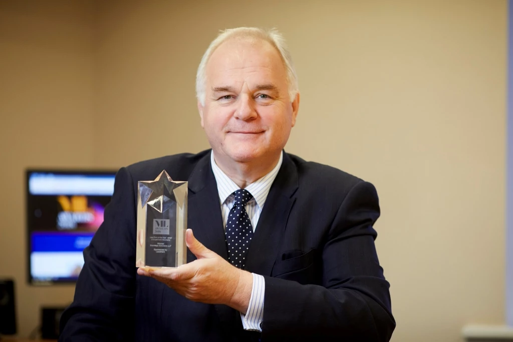 Mark Hirst with the trophy won by Bromleys at the 2018 Manchester Legal Awards.