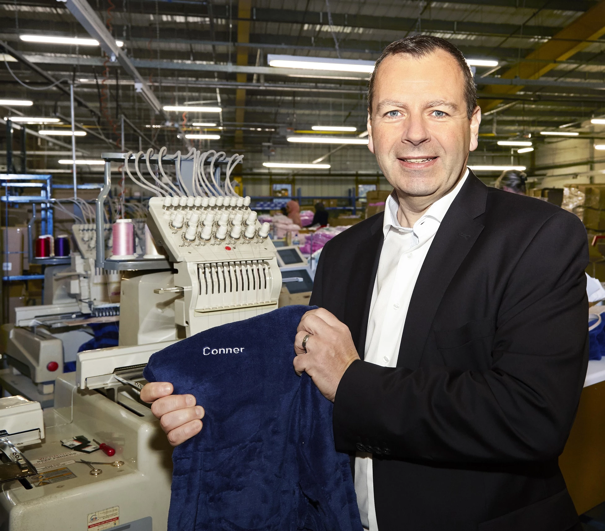 Paul Kendrick, Managing Director of Express Gifts, holds personalised giftware from Studio.co.uk