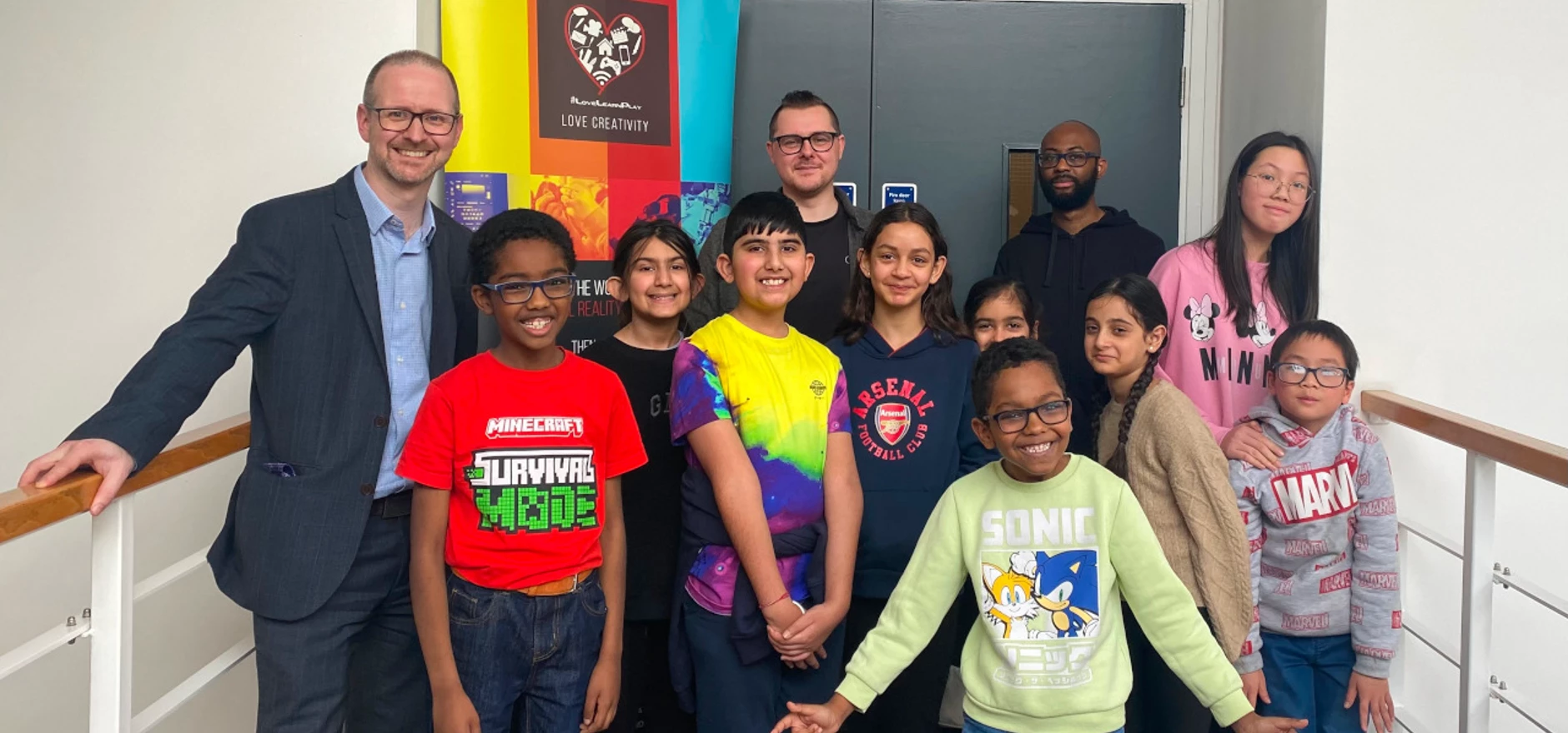 Neil Johnston, Simon Gull and Justin Rutherford with children at LearnPlay Foundation.jpg