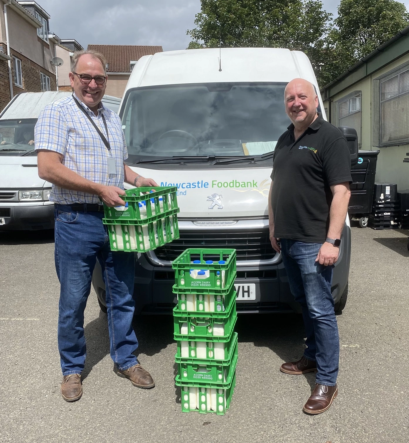 Ian Pilkington, chairman of Food and Drink North East, delivers fresh milk to Newcastle West End Foodbank chief executive, John McCorry