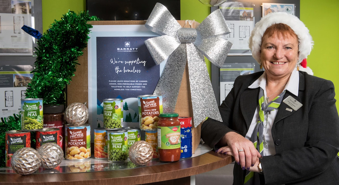 Sales Adviser, Shirley with the Christmas donation box