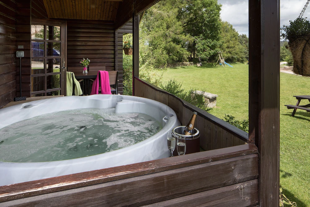 Each log cabin features its own private hot tub